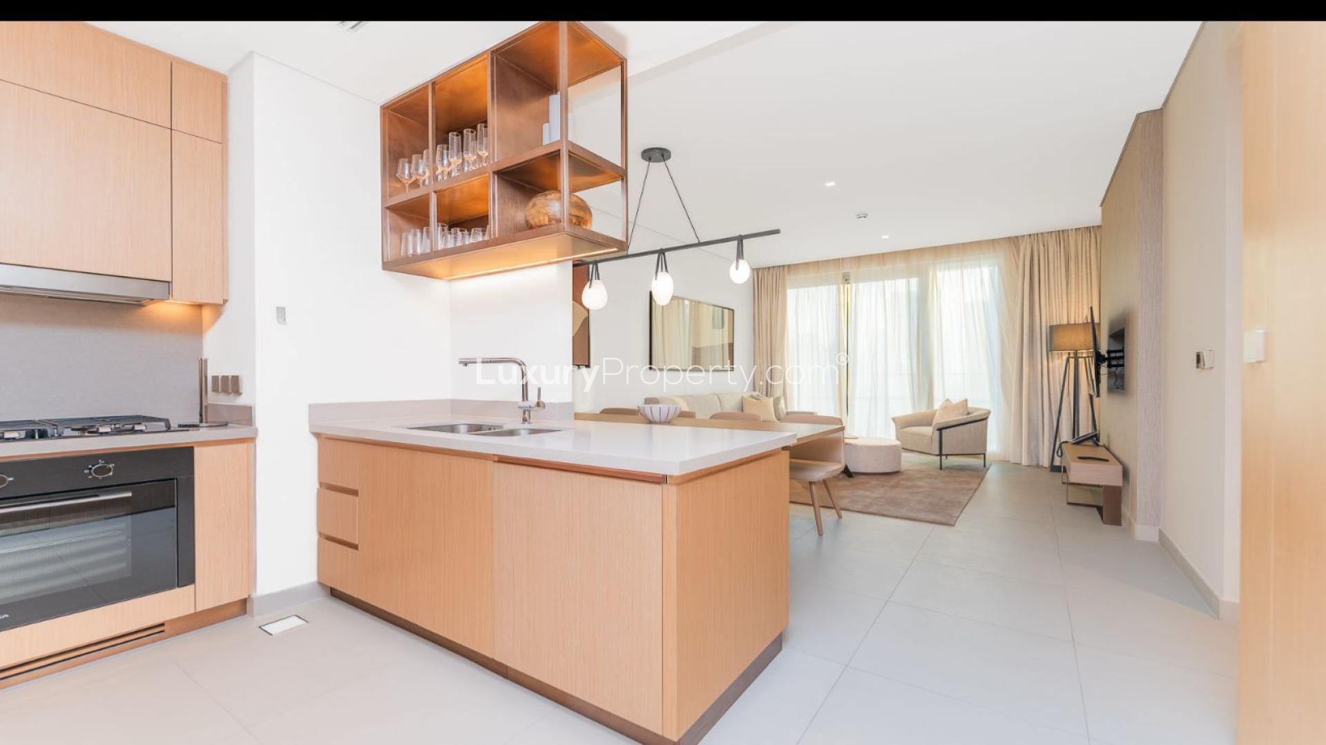 Modern living room in Vida Dubai Mall apartment, Downtown. Spacious, elegant design with dining area