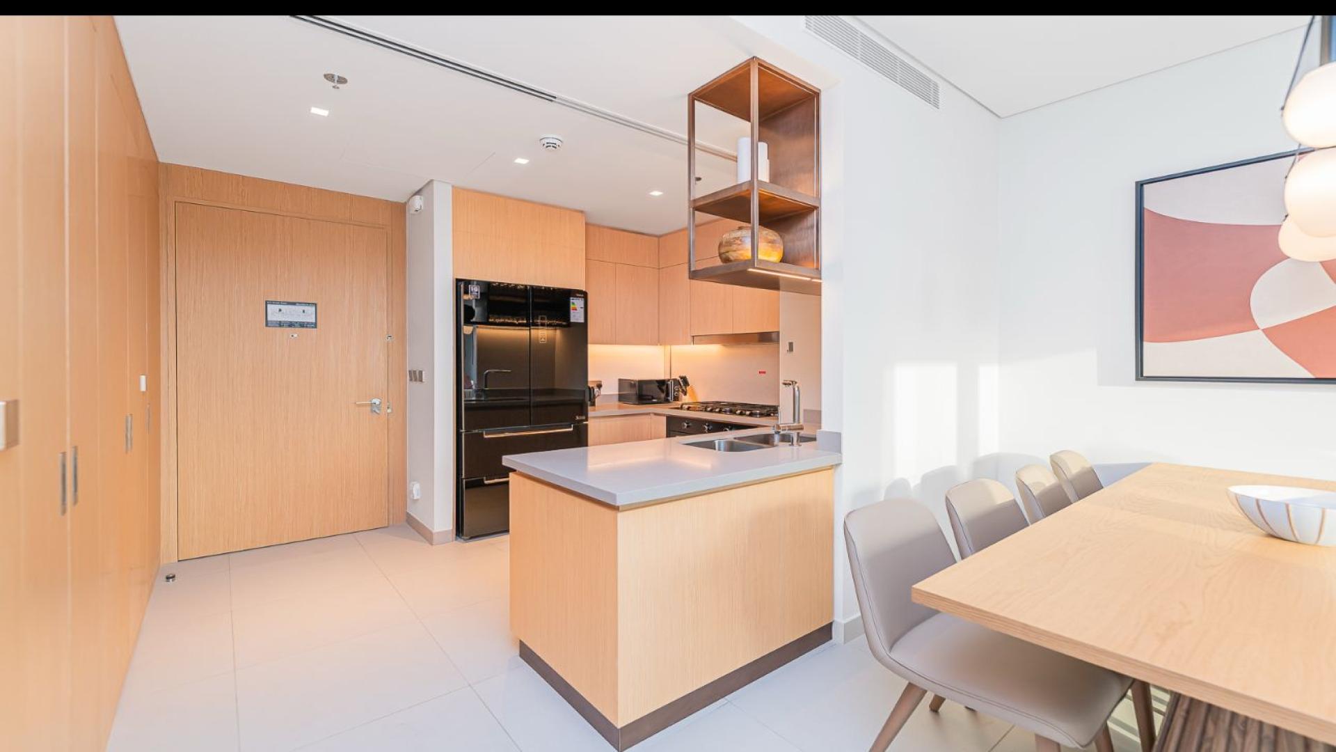 Modern kitchen and living area in Vida Dubai Mall apartment for rent, Downtown