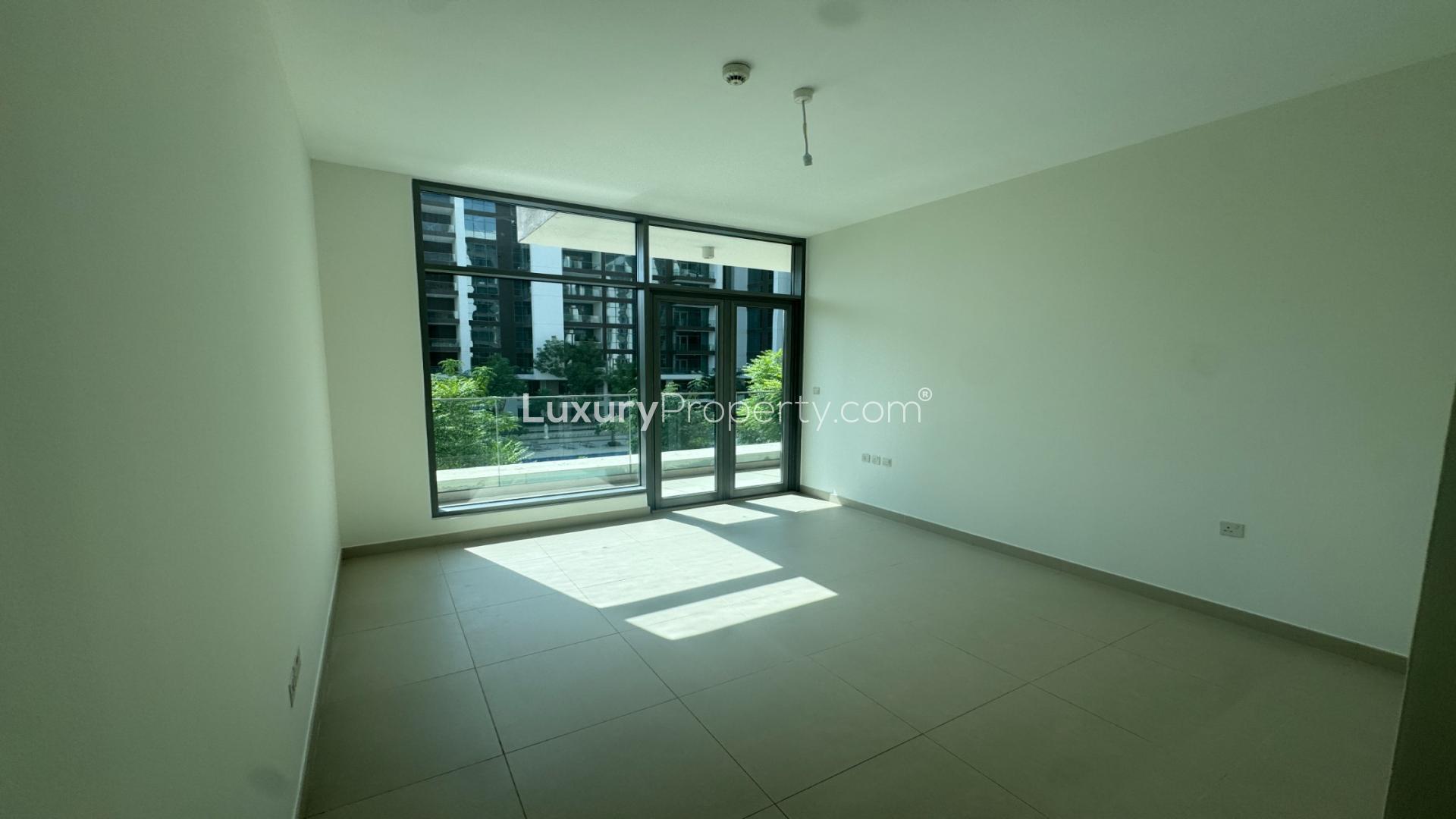 "Spacious balcony with park view in Acacia, Dubai Hills apartment for rent, Ref: LP46728.",Bright living room with large windows in Acacia, Dubai Hills apartment for rent