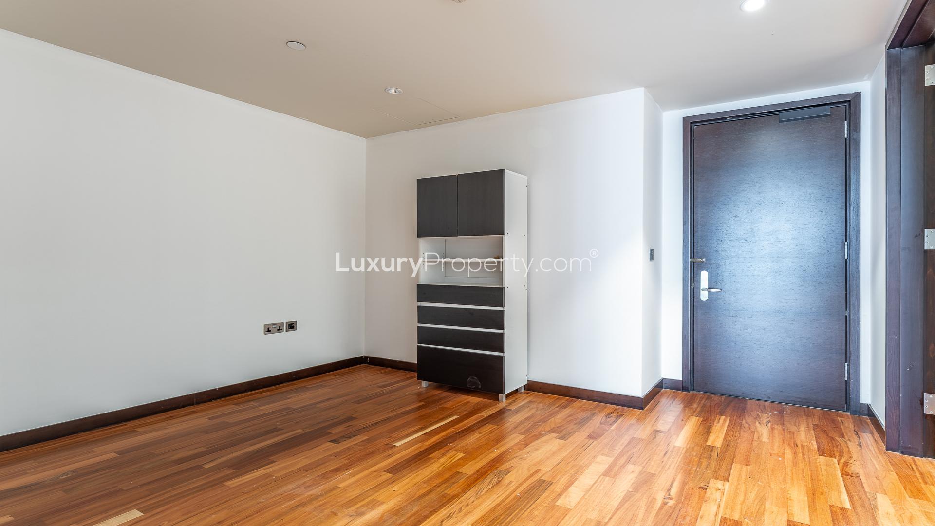 Luxury 3-bedroom apartment hallway with wooden floors in Burj Khalifa, available for rent
