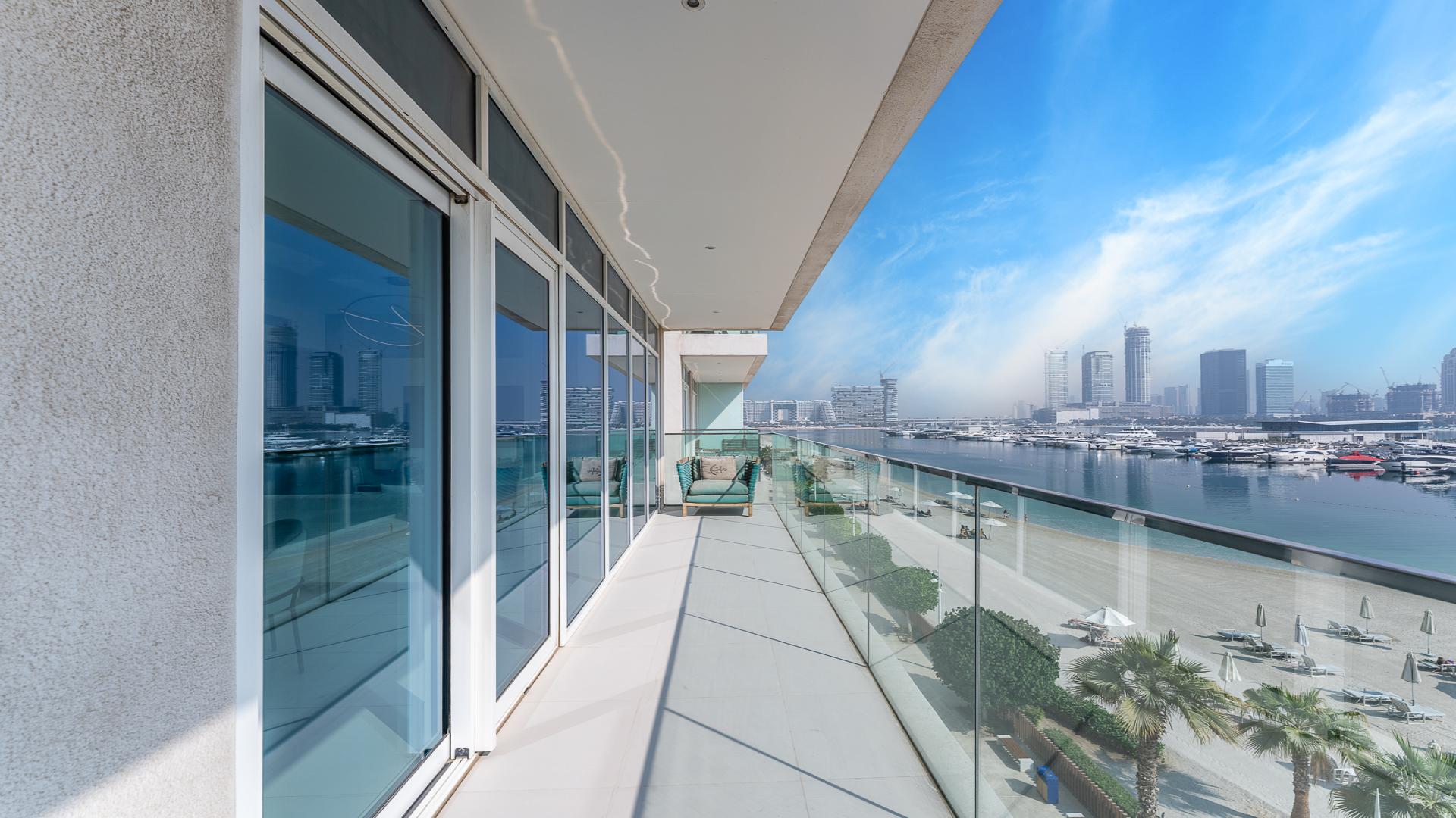 Furnished living room with modern decor in Sunrise Bay apartment, Emaar Beach Front, Dubai