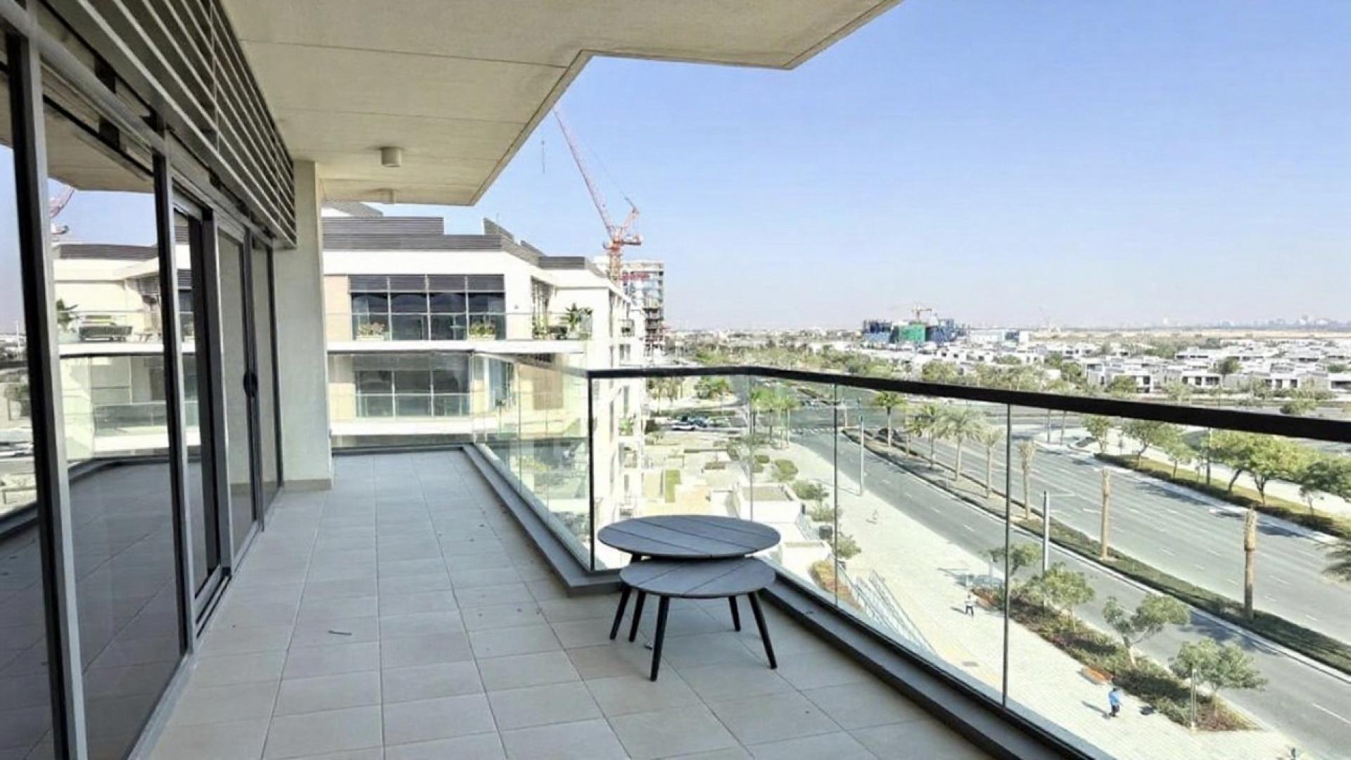 Furnished kitchen with bar stools, natural light, Dubai Hills Estate apartment for rent