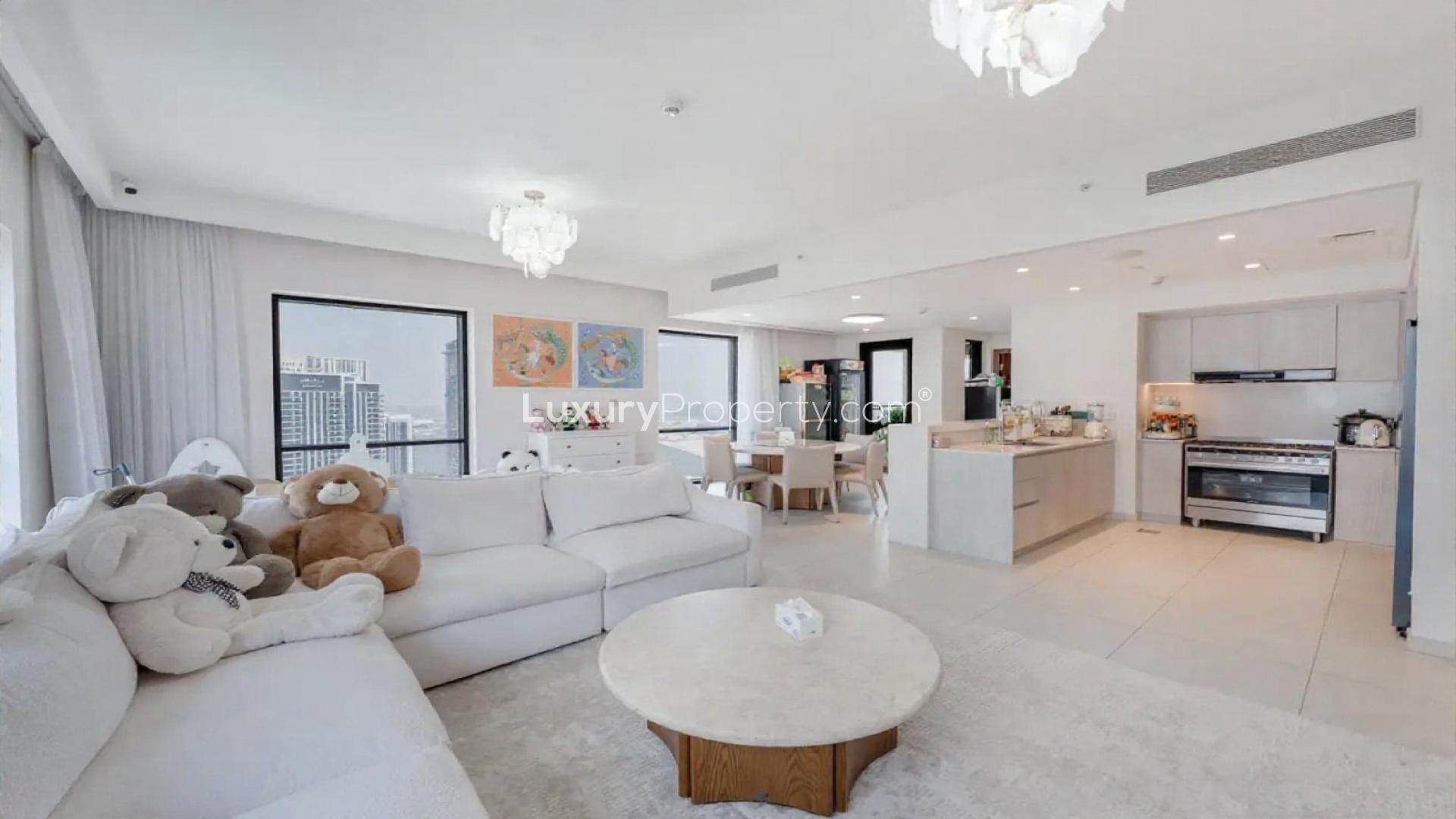 Spacious high-floor living room in Vida Creek Harbour apartment, luxury rental with city views