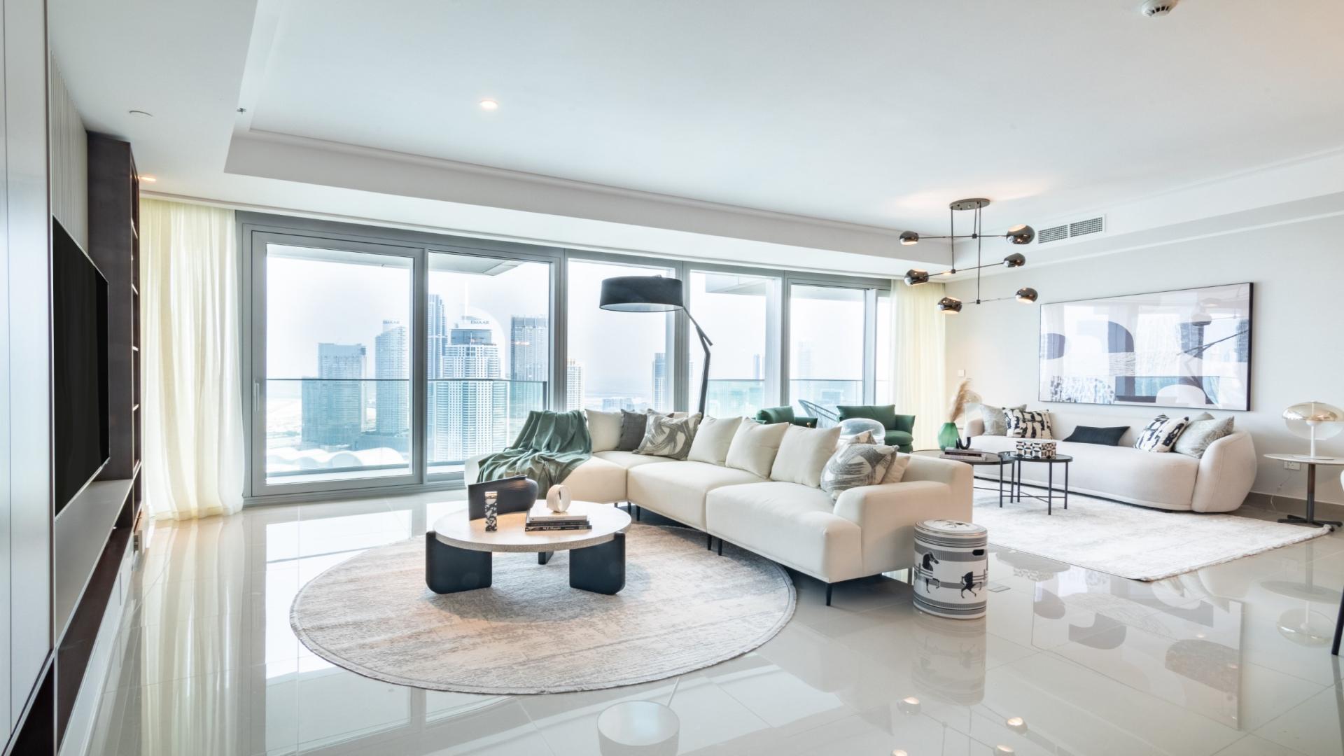 Luxurious Downtown Opera Grand apartment living room with city view, modern decor, large windows