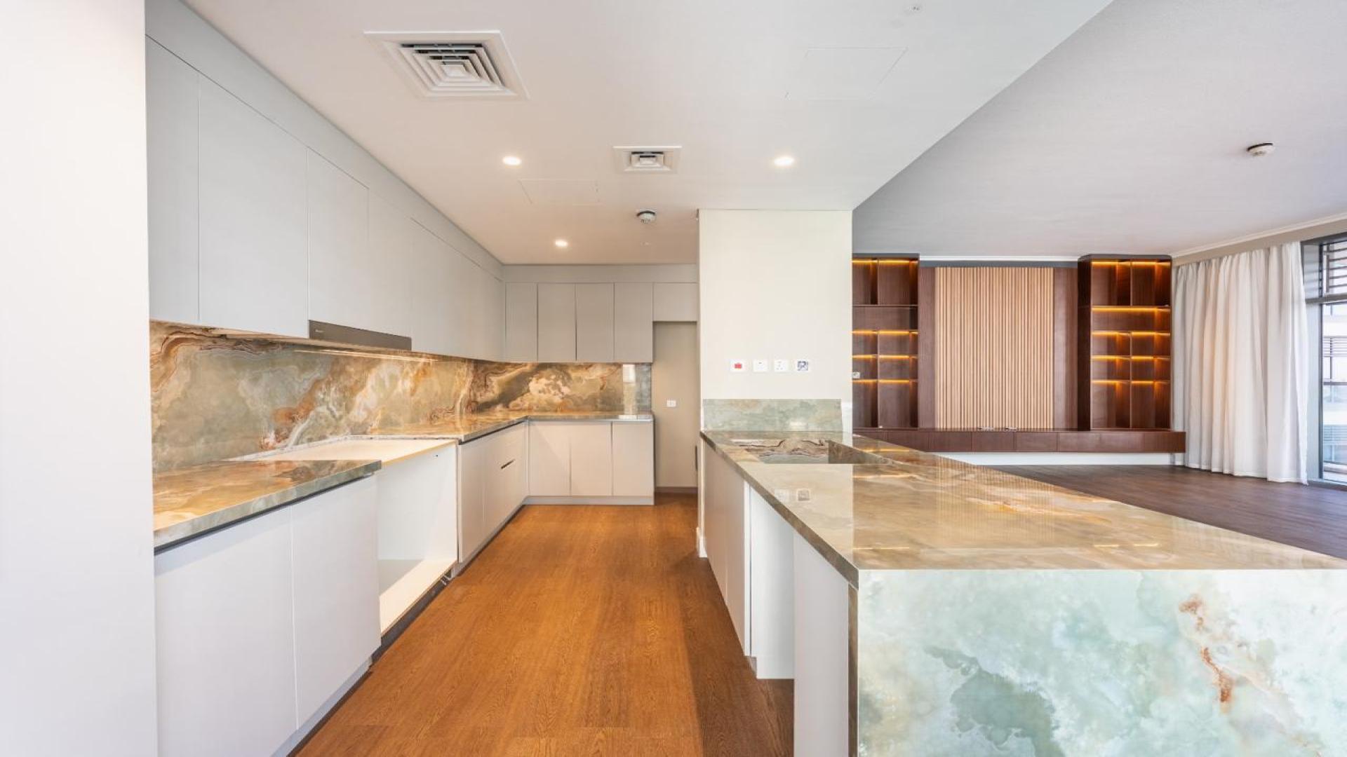 Balcony view of Mulberry 2 Park Heights apartment overlooking pool and modern architecture