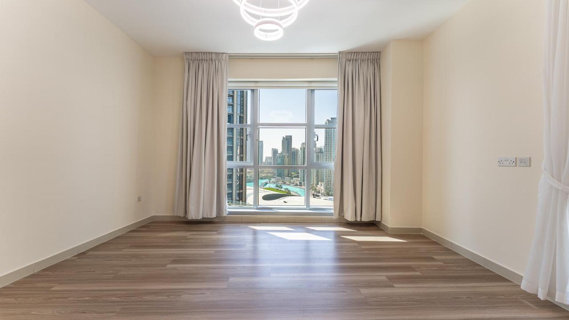 Spacious living room in Standpoint Tower 2 apartment, Downtown Dubai, with modern lighting fixtures