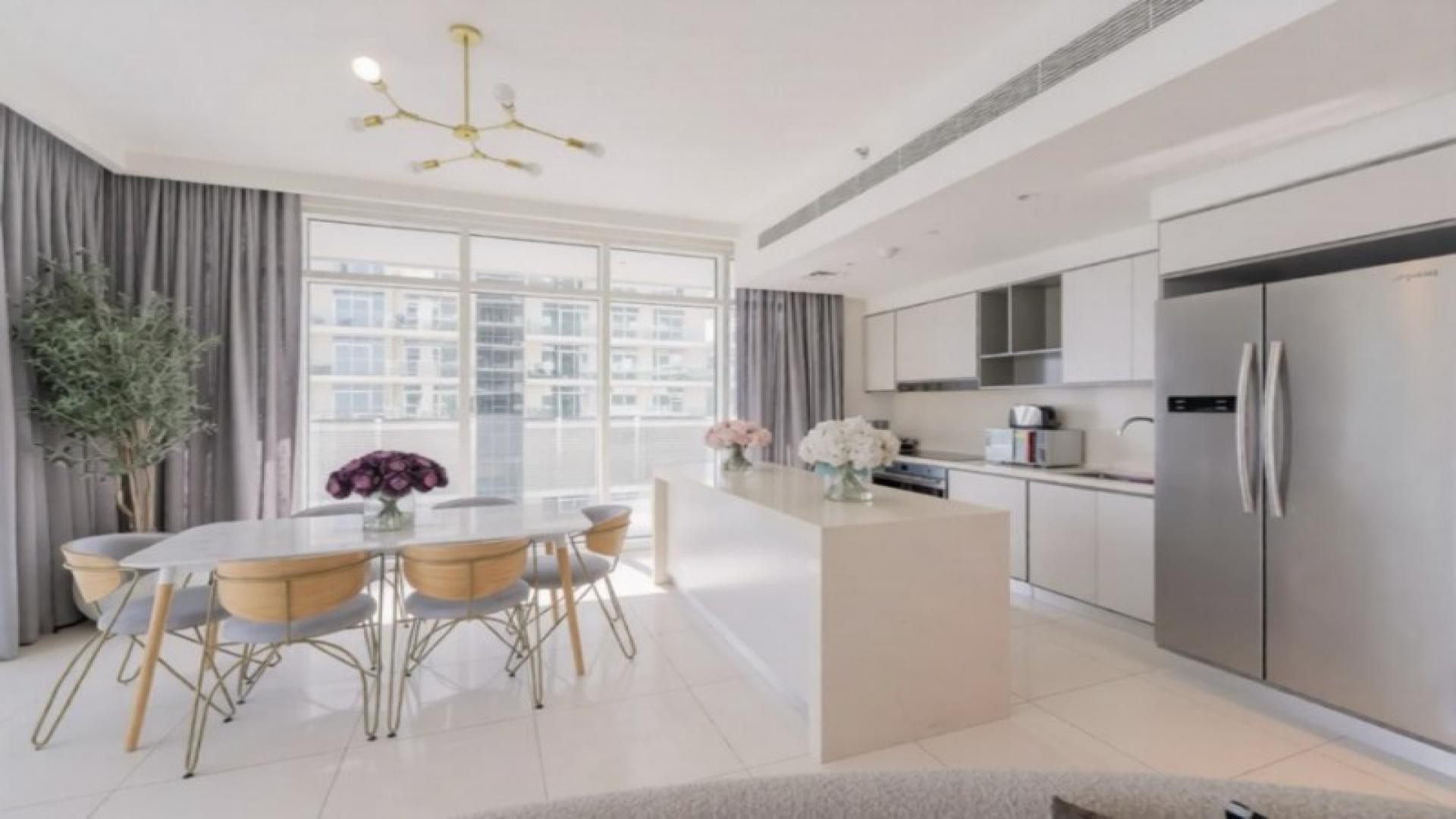 Modern kitchen and dining area in Sunrise Bay Tower 2, Emaar Beachfront apartment for rent