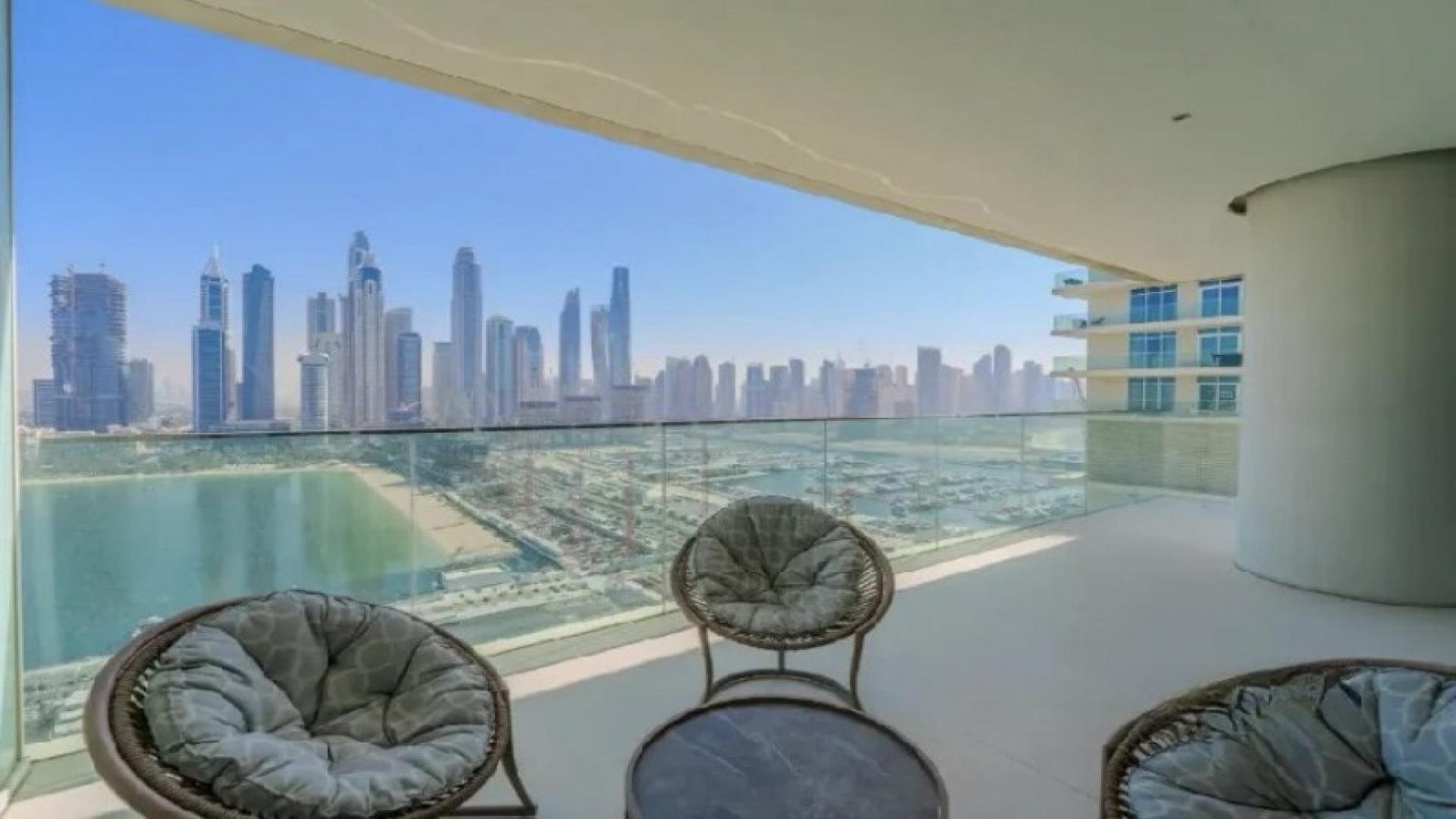 Modern living room and kitchen in Sunrise Bay Tower 2 apartment, Emaar Beachfront