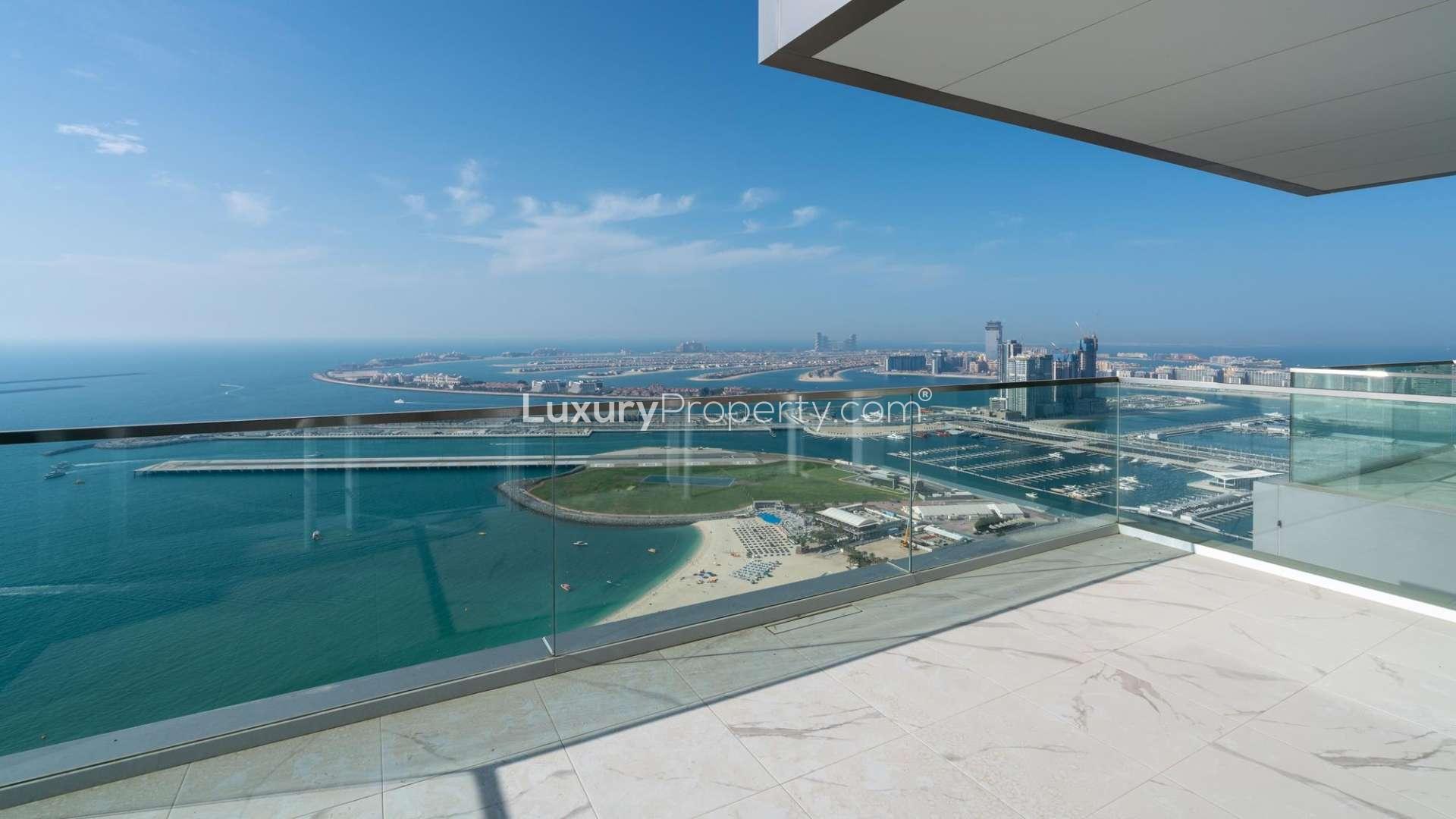 "Spacious living room with ocean view in 3-bedroom apartment, 1 JBR, Jumeirah Beach Residence.","Stunning sea view from luxury 3-bedroom apartment balcony in Jumeirah Beach Residence.",Spacious living area in luxury 3-bedroom apartment, 1 JBR, Jumeirah Beach Residence