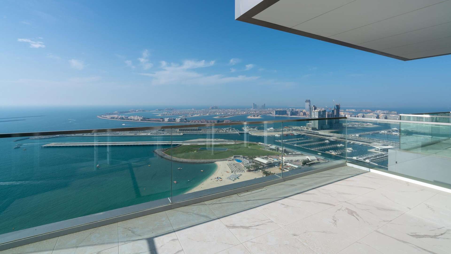 "Spacious living room with ocean view in 3-bedroom apartment, 1 JBR, Jumeirah Beach Residence.","Stunning sea view from luxury 3-bedroom apartment balcony in Jumeirah Beach Residence.",Spacious living area in luxury 3-bedroom apartment, 1 JBR, Jumeirah Beach Residence