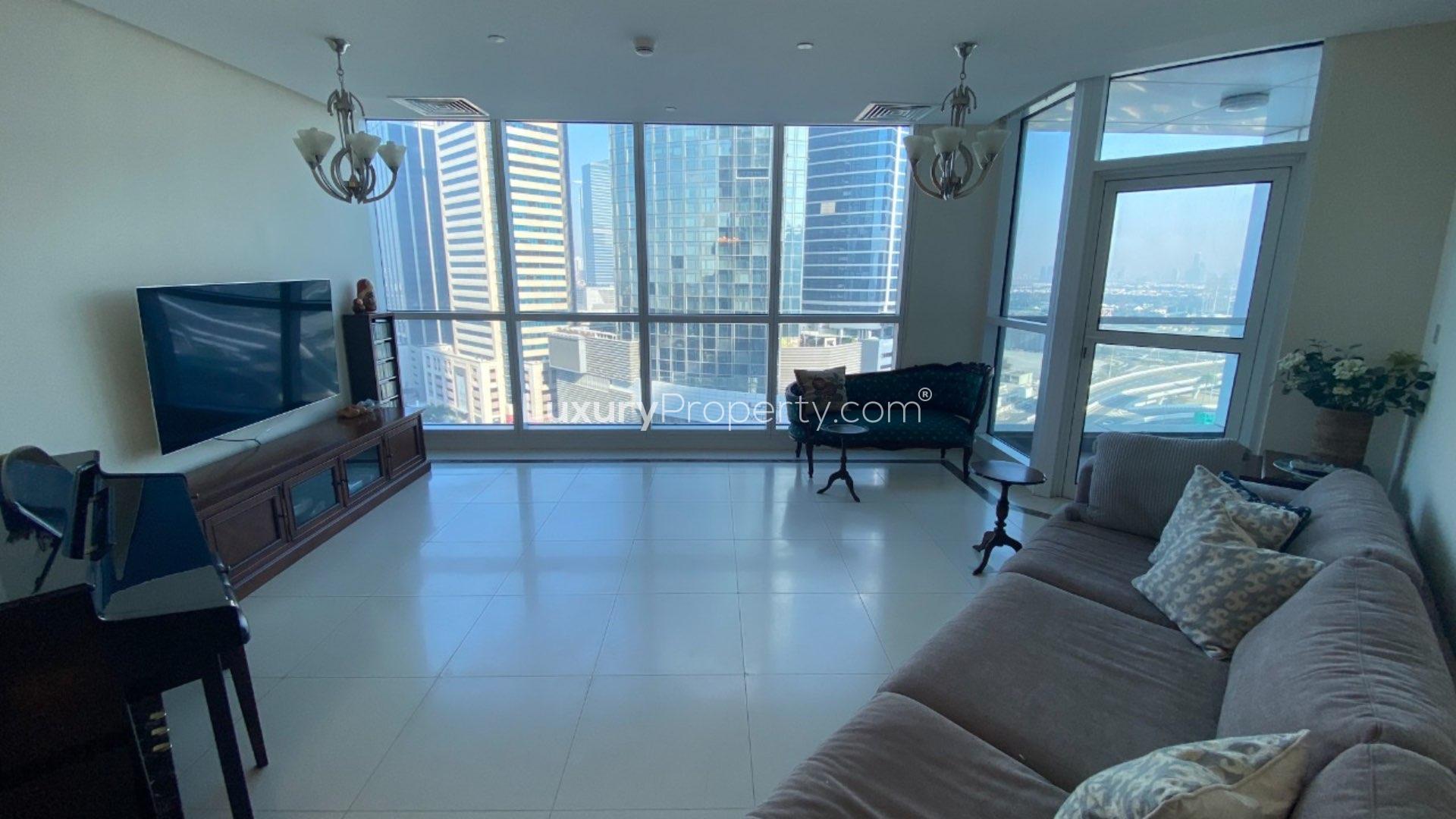 Dining area in 3-bedroom apartment, 23 Marina, Dubai Marina. Elegant wooden table, cozy decor