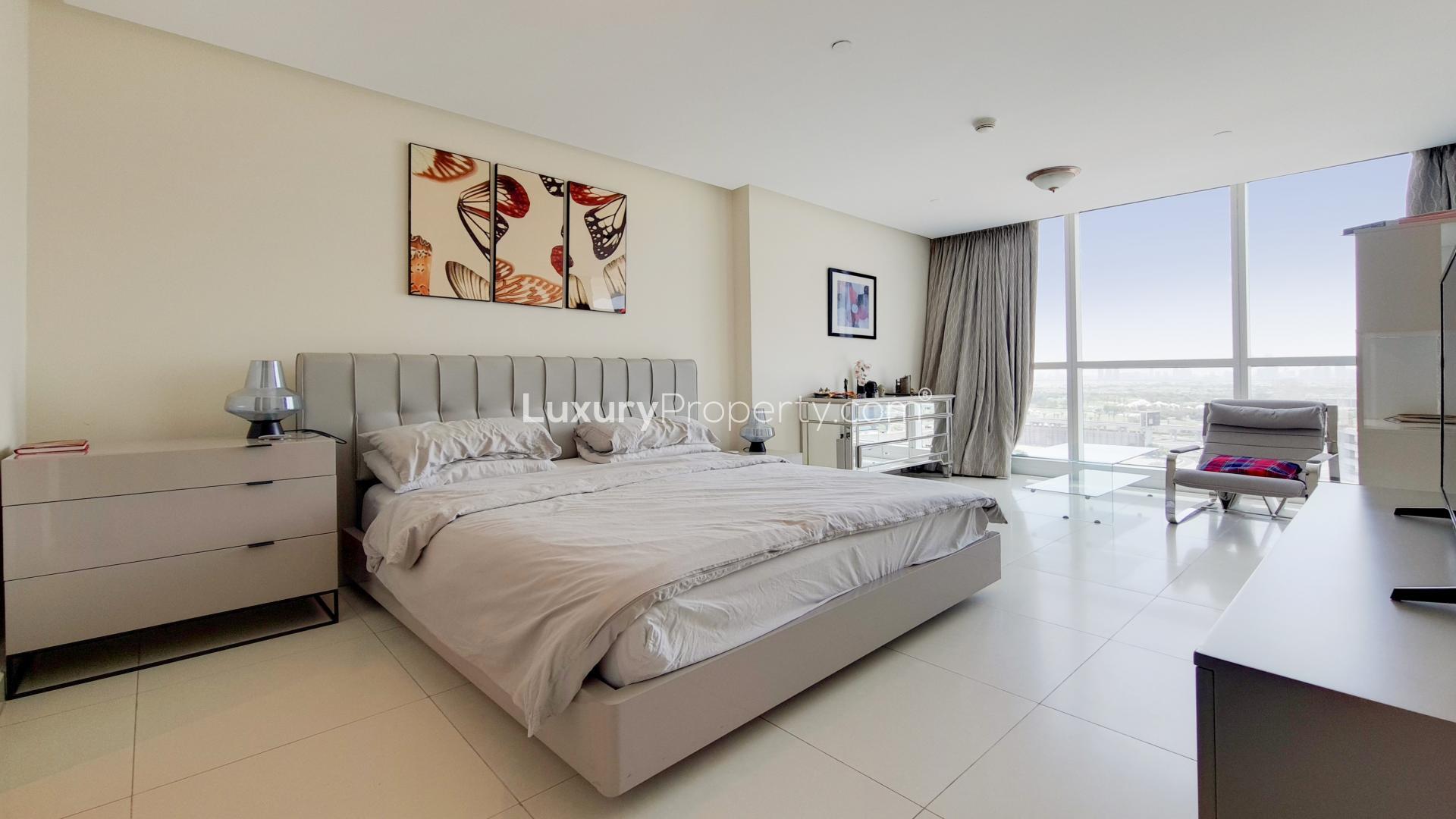 Contemporary living room with skyline views in Dubai Marina apartment for rent