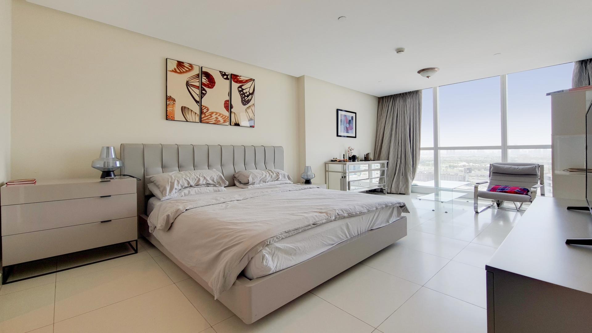 Contemporary living room with skyline views in Dubai Marina apartment for rent