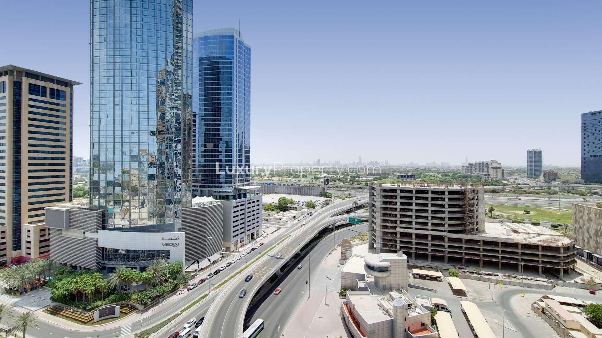 Contemporary bedroom in Dubai Marina apartment with skyline view, modern furnishings, and large windows