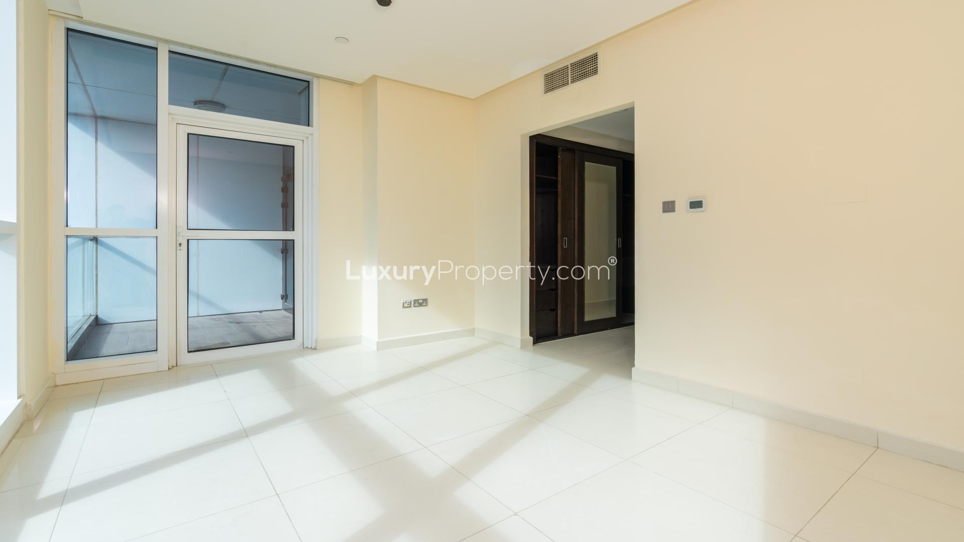 Spacious walk-in closet with wooden finish in 3-bedroom apartment, 23 Marina, Dubai Marina