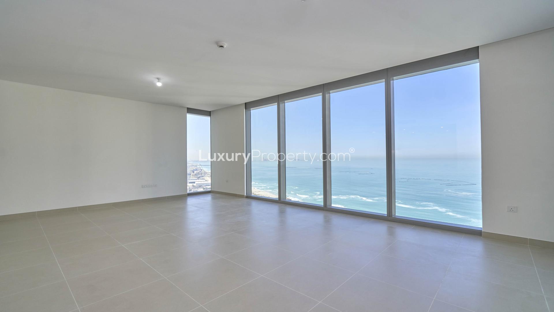 "Spacious Marina apartment with panoramic Ain Dubai view, large windows, bright interior, Dubai Marina.",Spacious Dubai Marina apartment with modern kitchen and open-plan living area in 5242 community