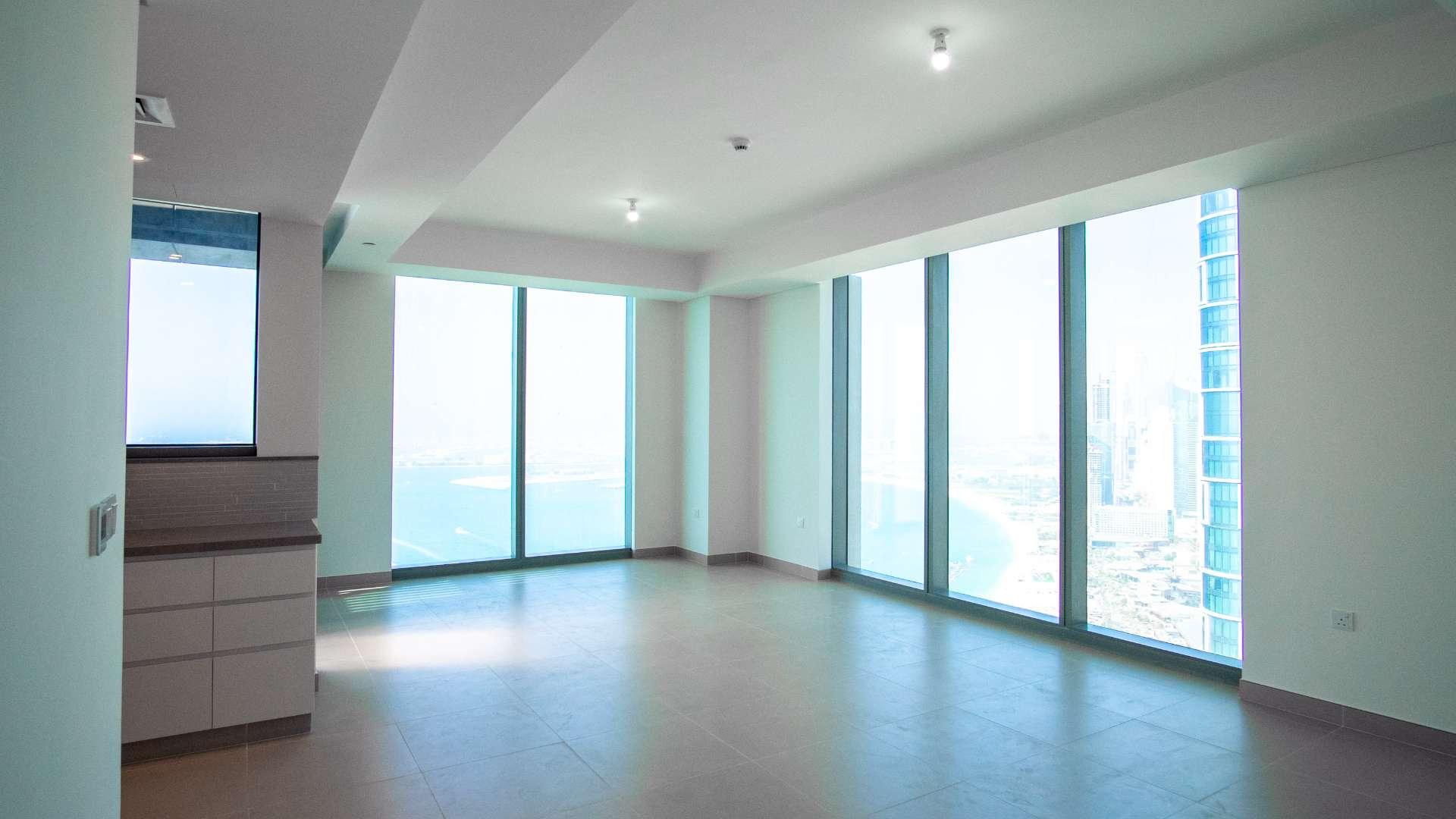 Balcony view of Dubai Marina from 5242 apartment, showcasing sea and cityscape