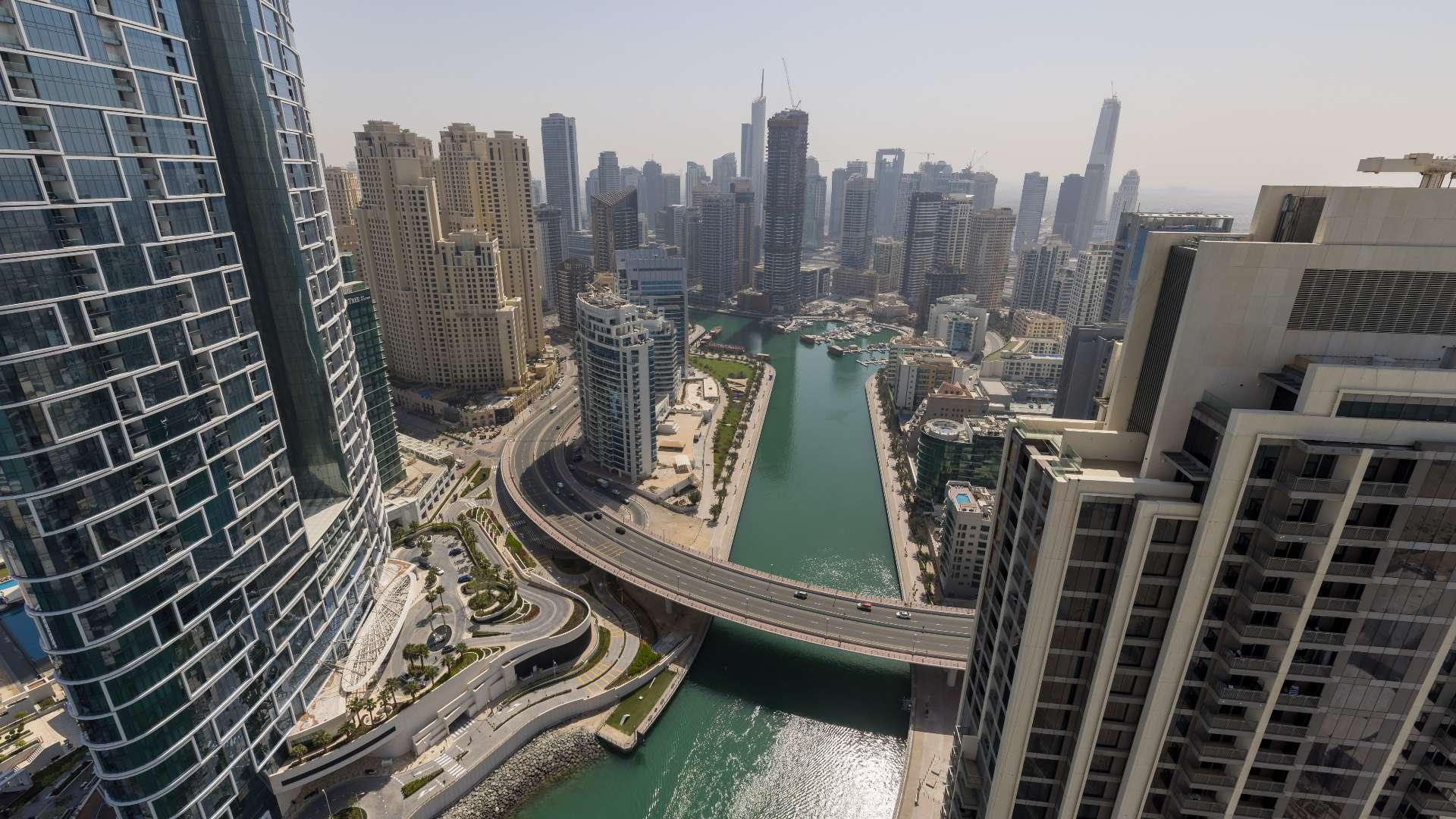 Modern kitchen and living area with marina views in Dubai Marina apartment