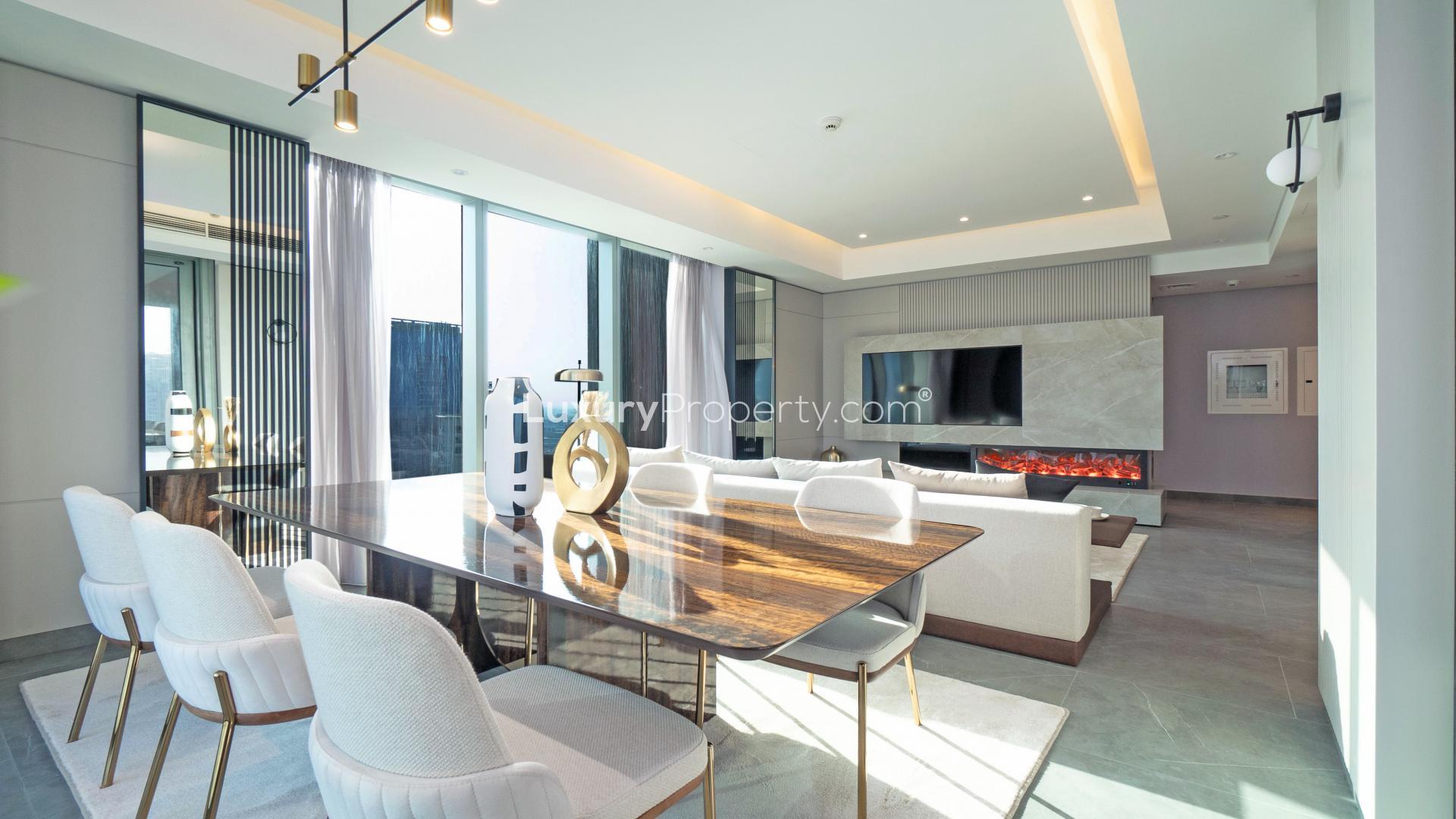 Modern Dubai Marina apartment living room with sea view, elegant decor, and spacious layout