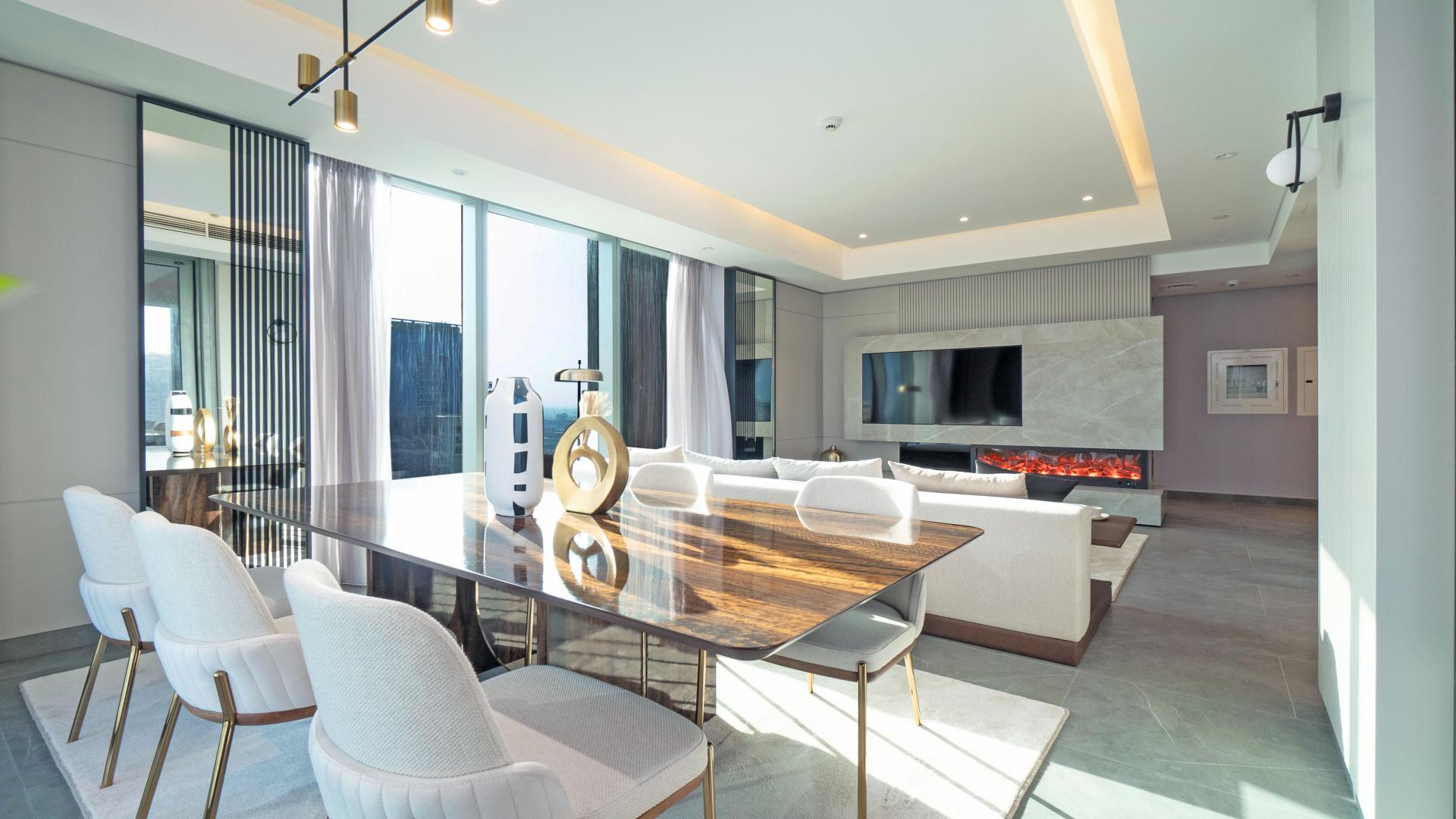 Modern Dubai Marina apartment living room with sea view, elegant decor, and spacious layout