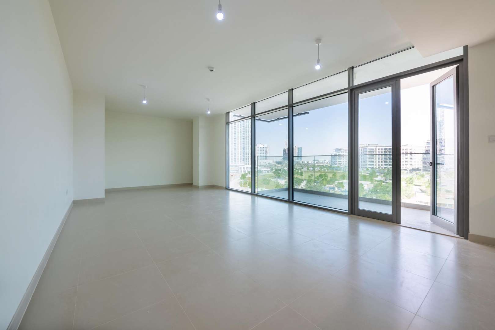 Balcony view from 3-bedroom apartment in Acacia Park Heights, Dubai Hills Estate, lush surroundings