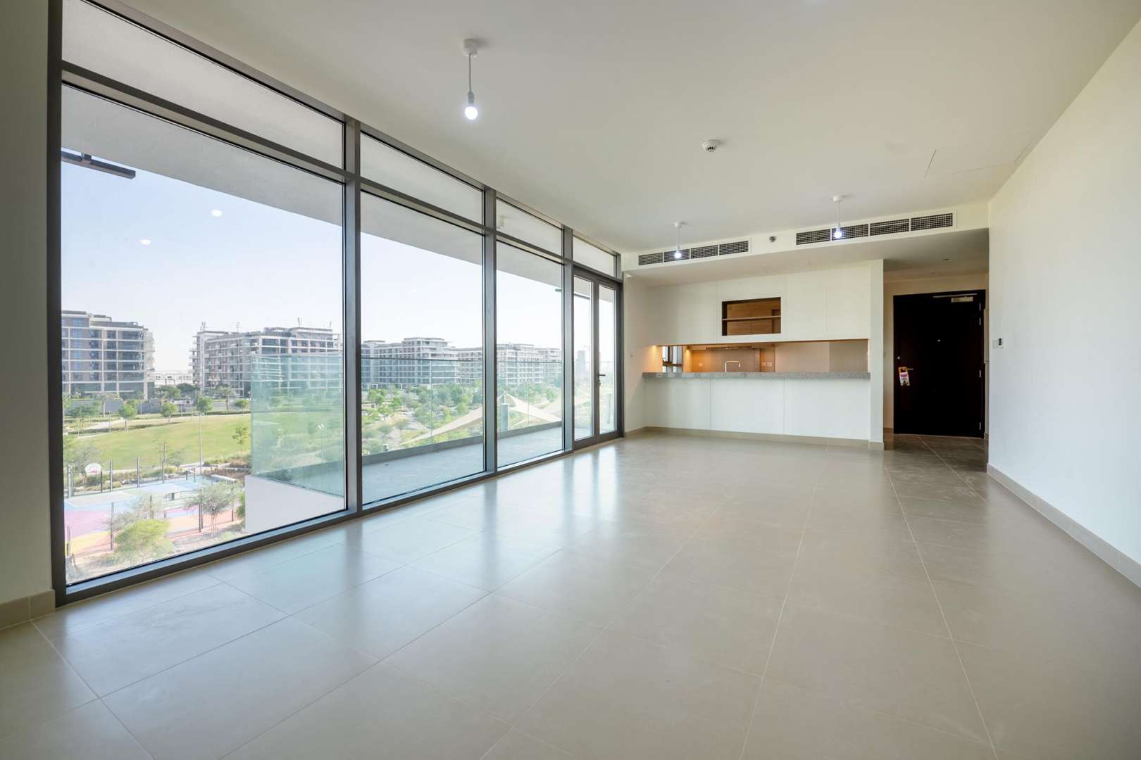 Spacious living area with large windows in Acacia Park Heights apartment, Dubai Hills Estate