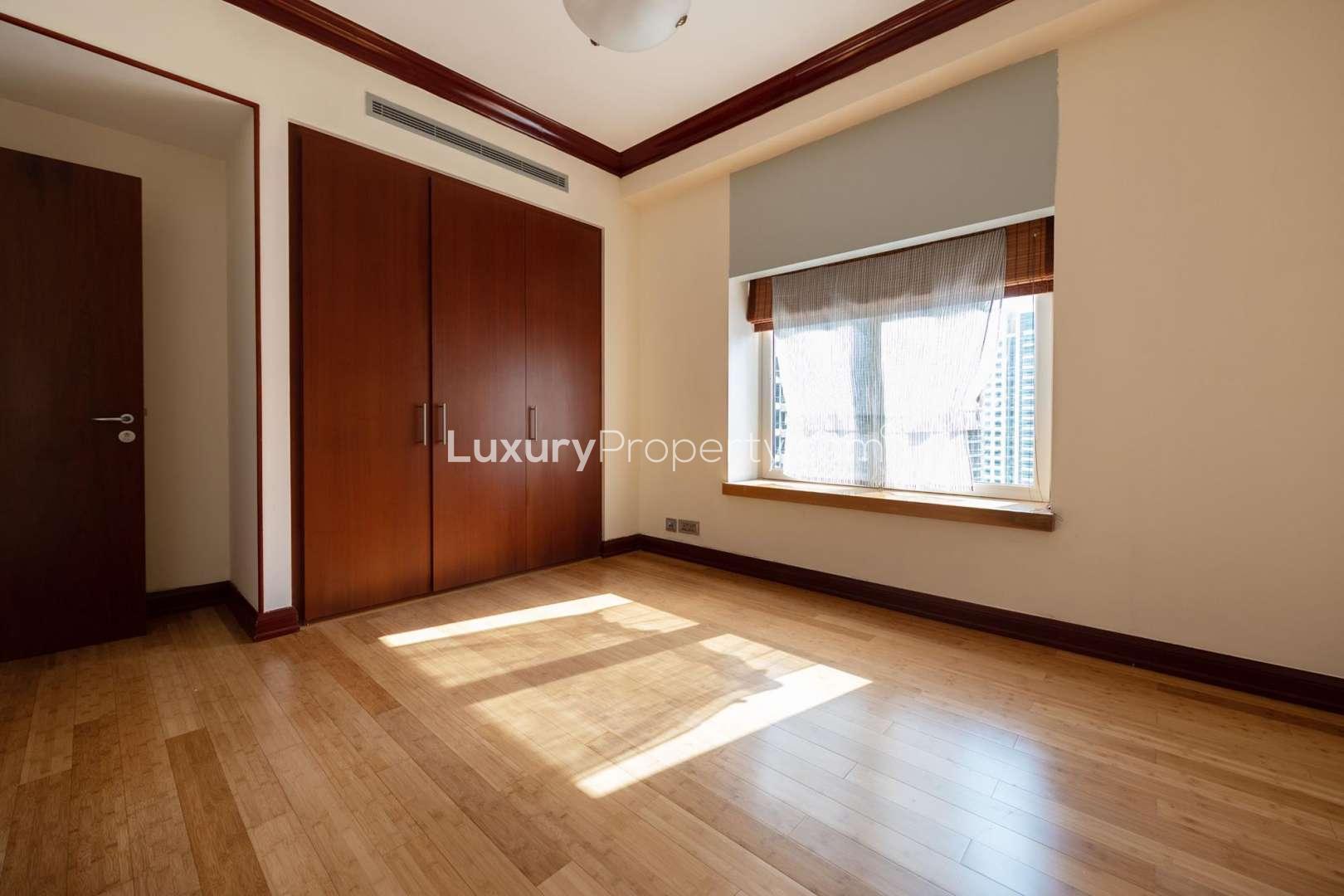 Spacious Dubai Marina apartment view from Al Anbar Tower, featuring large windows and waterfront