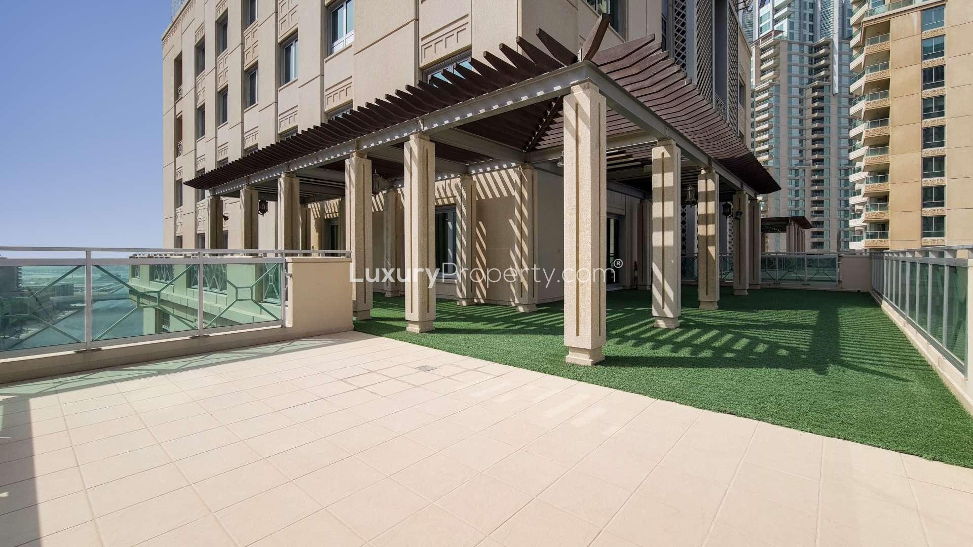 Spacious living area in Emaar 6 Towers duplex, Dubai Marina, with large windows and terrace