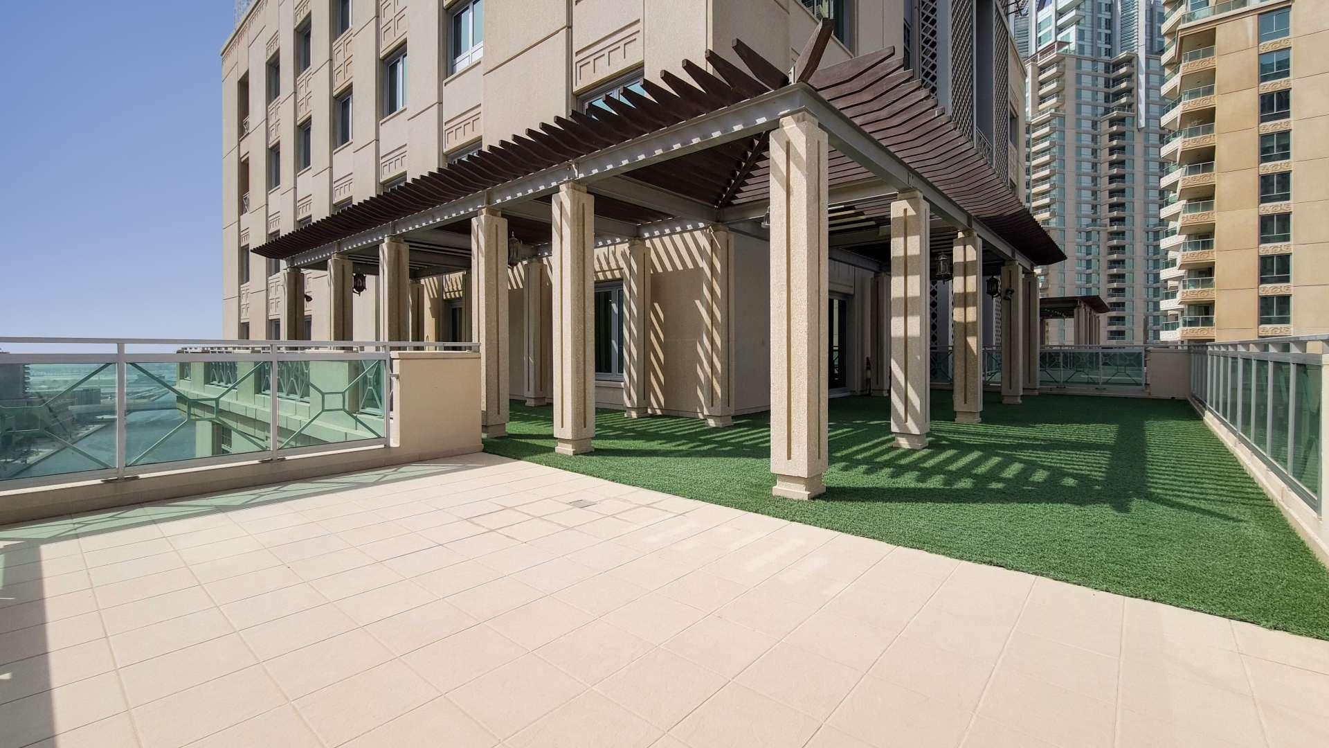 Spacious living area in Emaar 6 Towers duplex, Dubai Marina, with large windows and terrace