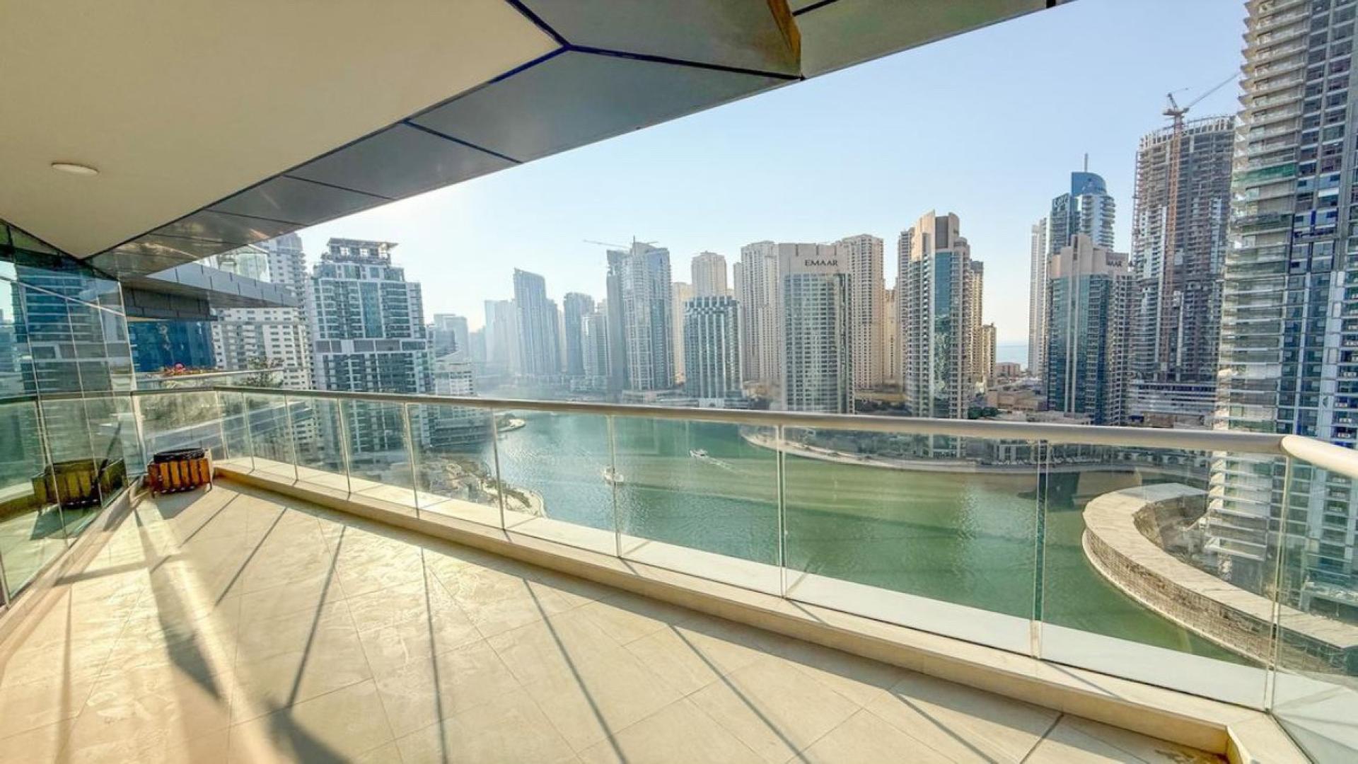 Spacious living room in Trident Bayside apartment, Dubai Marina, featuring modern decor and furniture