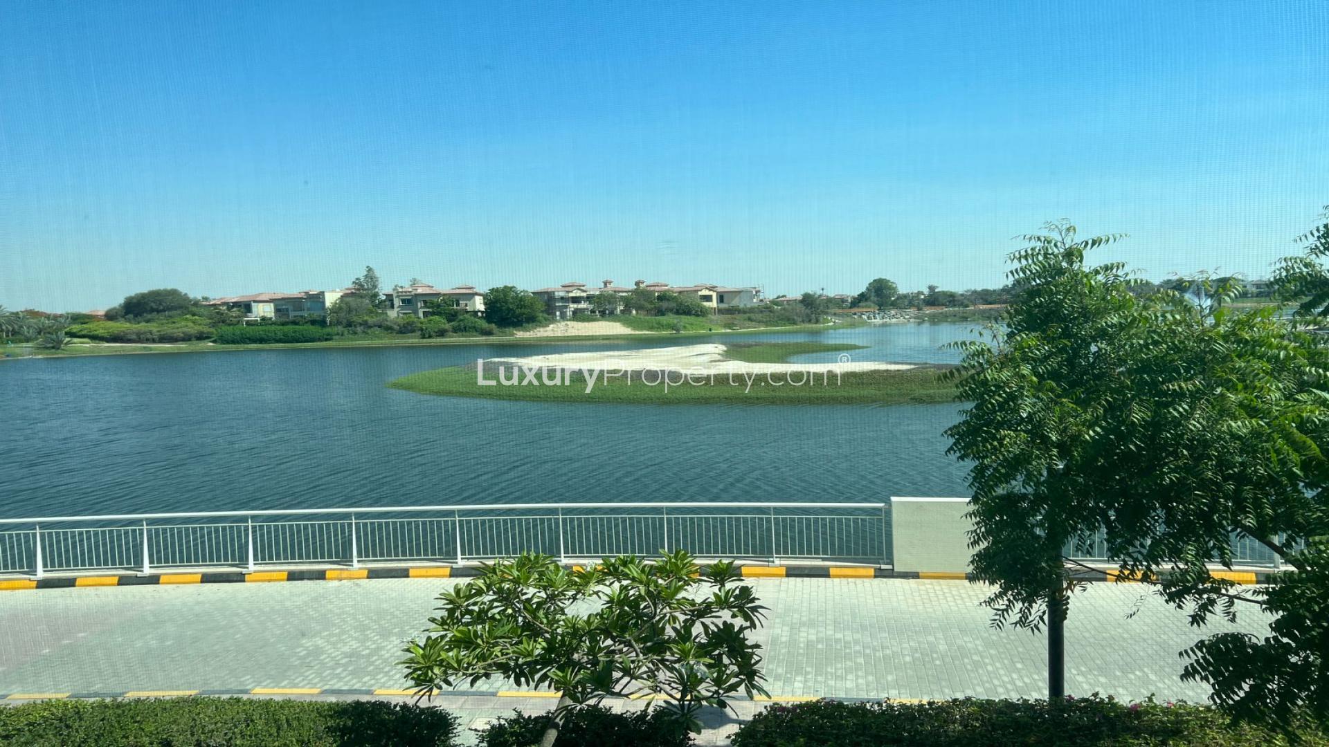 Open-plan living area with staircase in Jumeirah Heights 3-bedroom duplex apartment for rent