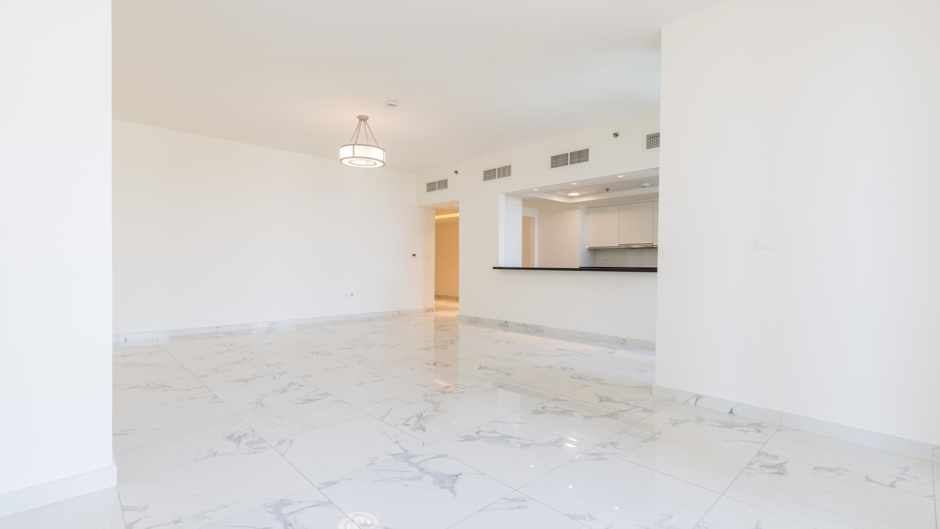 Spacious living area with marble flooring in Al Habtoor City apartment, Business Bay