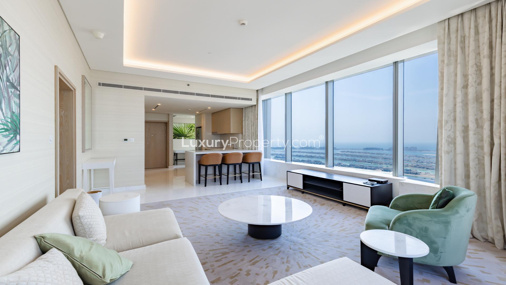 Luxurious Palm Jumeirah apartment living room with ocean view, modern decor, and natural light