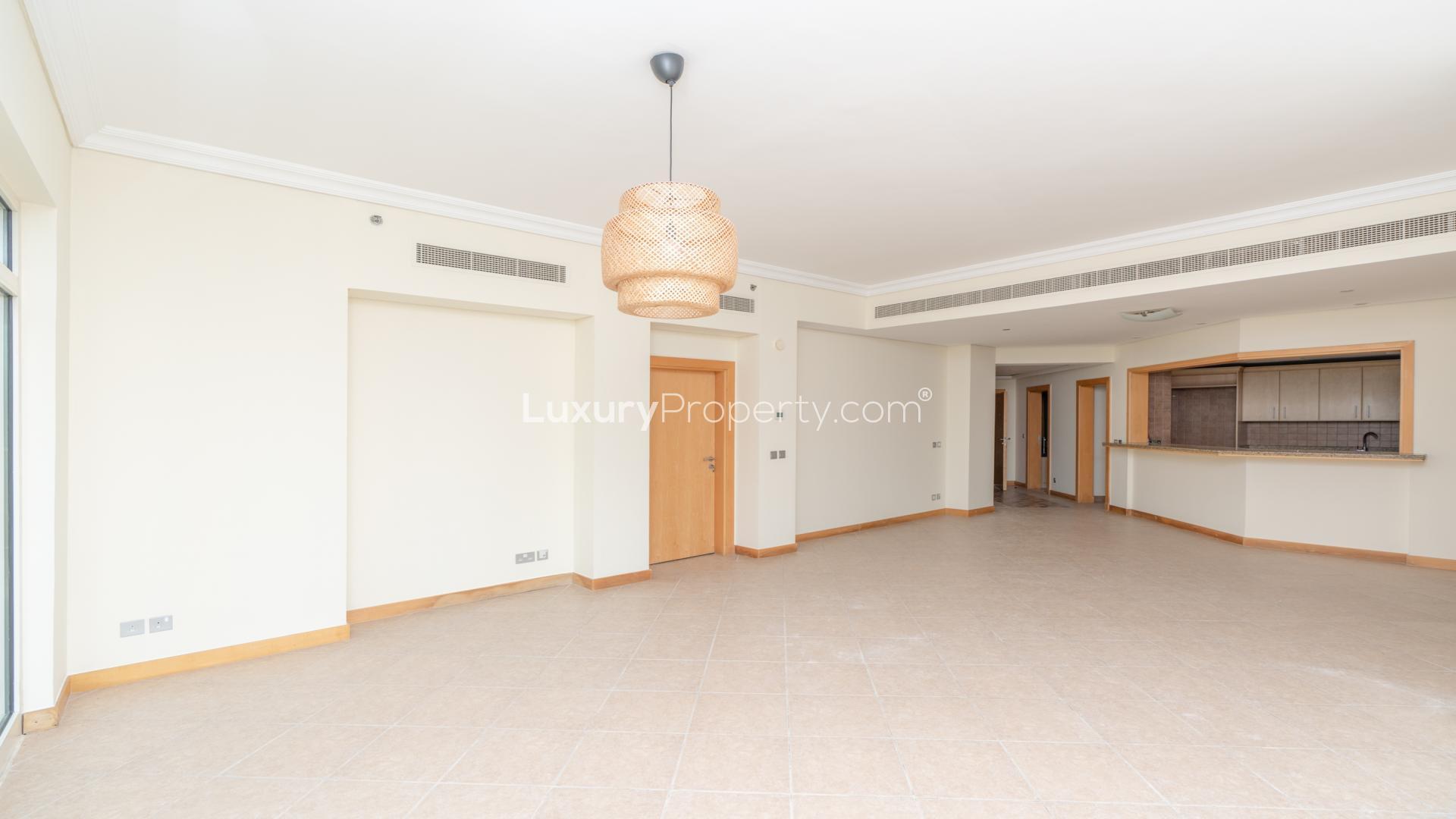 Spacious living room in Al Nabat apartment, Palm Jumeirah, with large windows and modern design