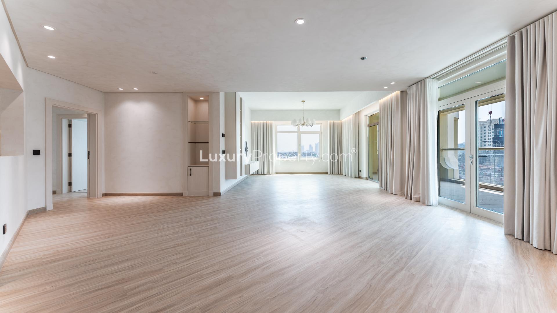 Vacant upgraded apartment interior with large windows