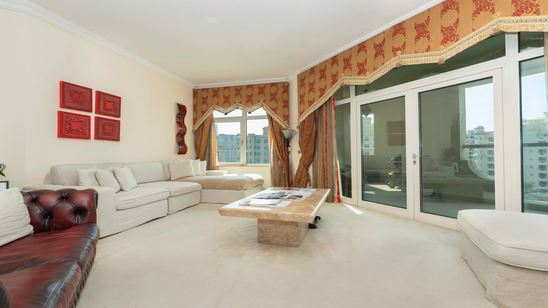 Living room in Shoreline Apartments, Palm Jumeirah, featuring elegant furnishings and natural light