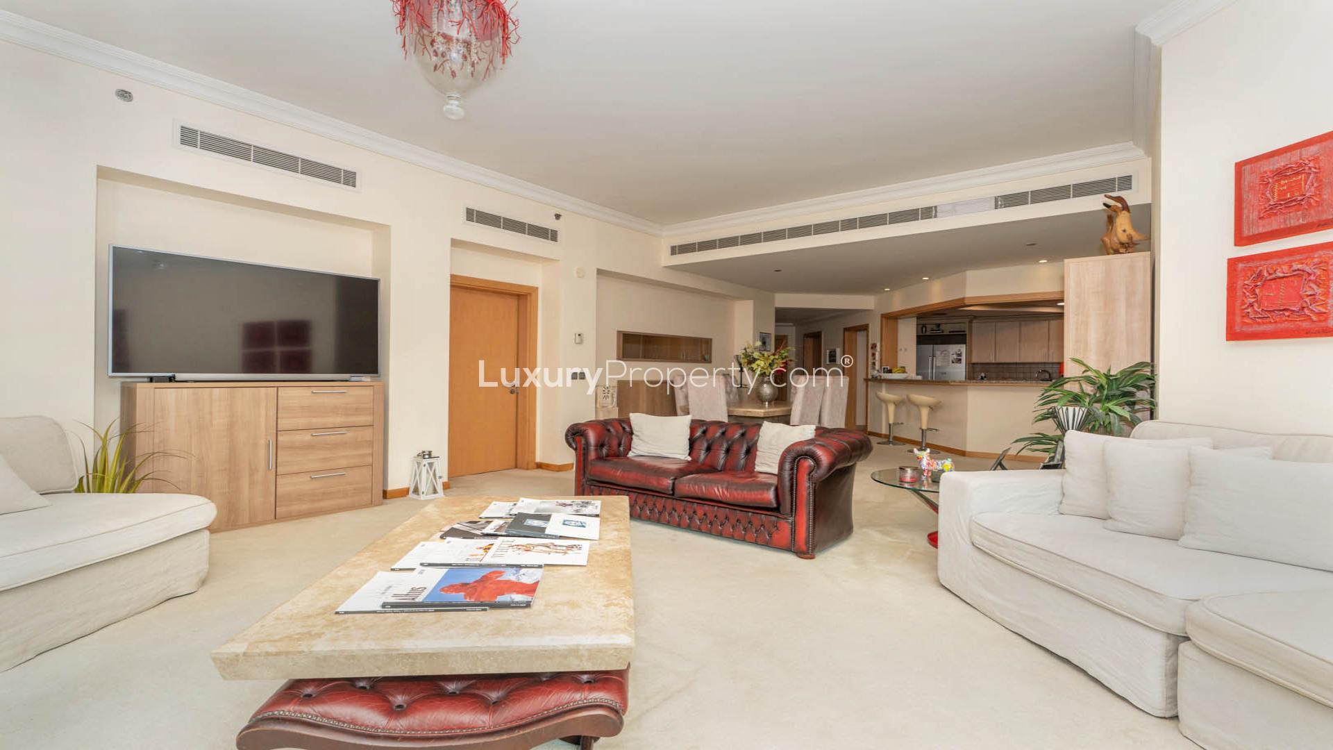 Luxurious living room in Shoreline Apartments, Palm Jumeirah, with elegant decor and large windows
