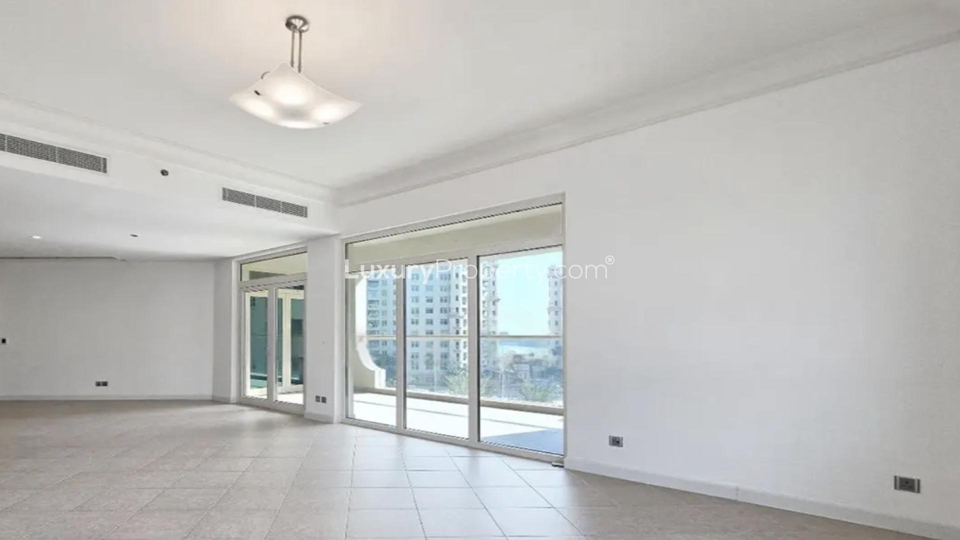 Empty room with large window view in Shoreline Apartments, Palm Jumeirah