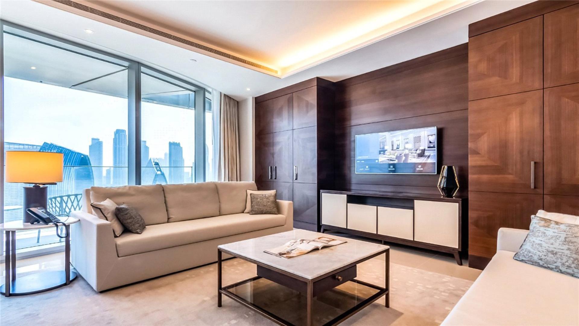 High-floor apartment living room with Burj Khalifa views in The Address Sky View Towers