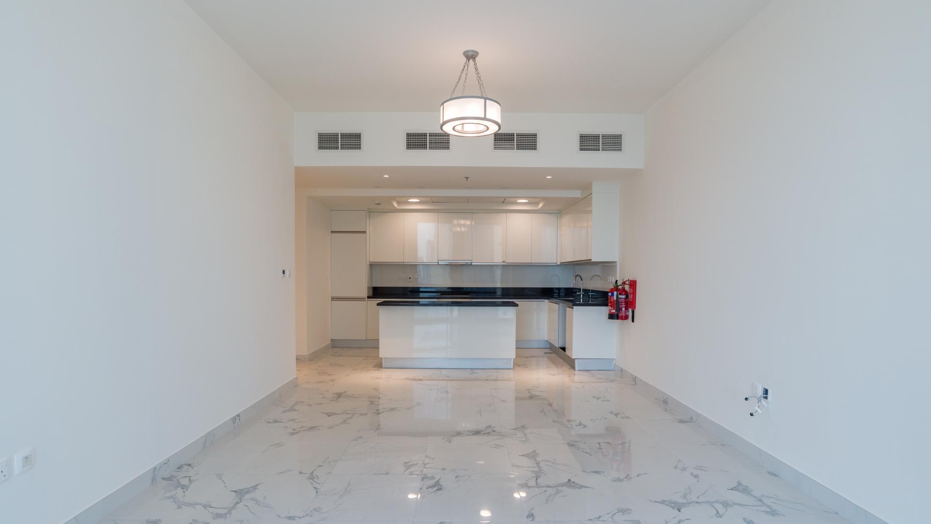 High-floor apartment interior with sea view, marble floors, and large windows in Business Bay