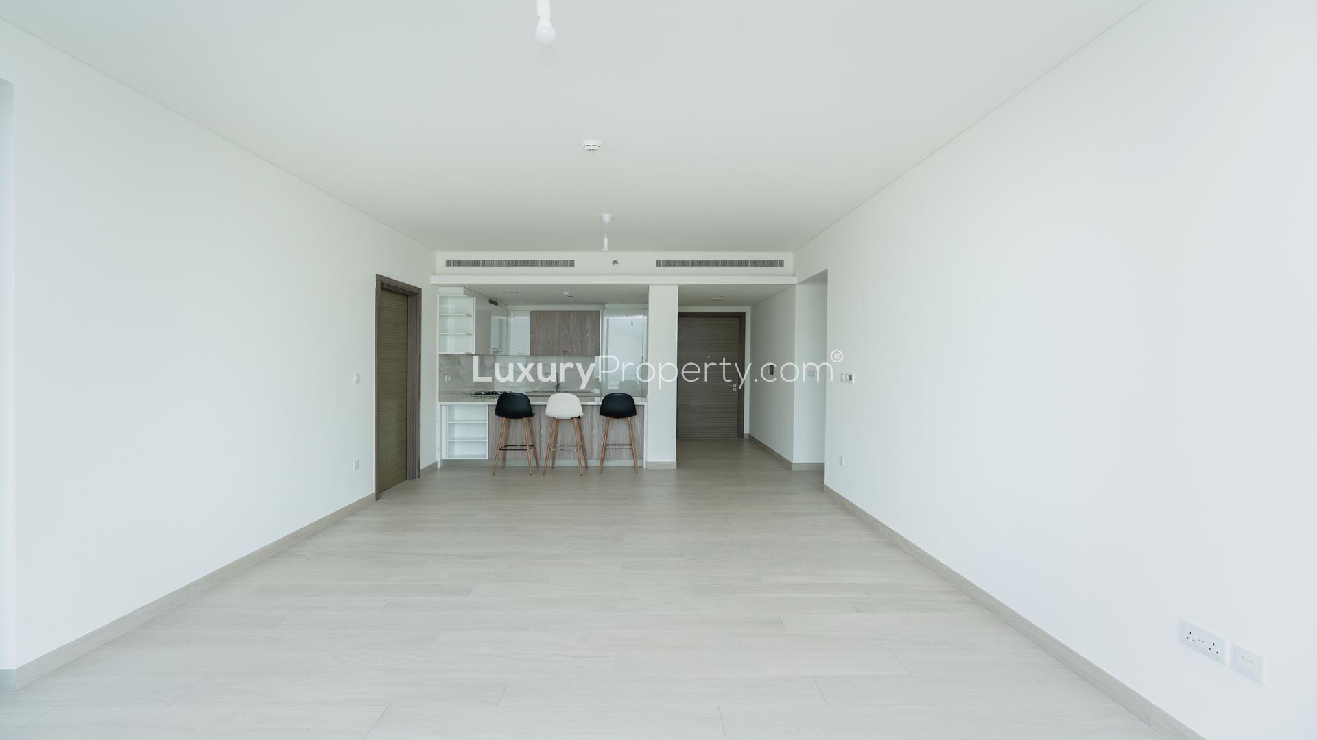 "Spacious balcony view from 3-bed apartment at One Park Avenue, Sobha Hartland, for rent.",Modern open-plan living area in 3-bed apartment, One Park Avenue, Sobha Hartland