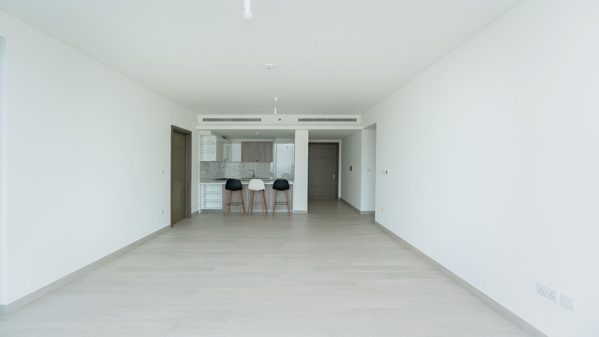 "Spacious balcony view from 3-bed apartment at One Park Avenue, Sobha Hartland, for rent.",Modern open-plan living area in 3-bed apartment, One Park Avenue, Sobha Hartland