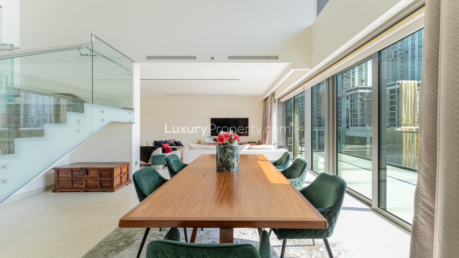 Modern kitchen with island and staircase in Hartland Greens duplex, Mohammed Bin Rashid City