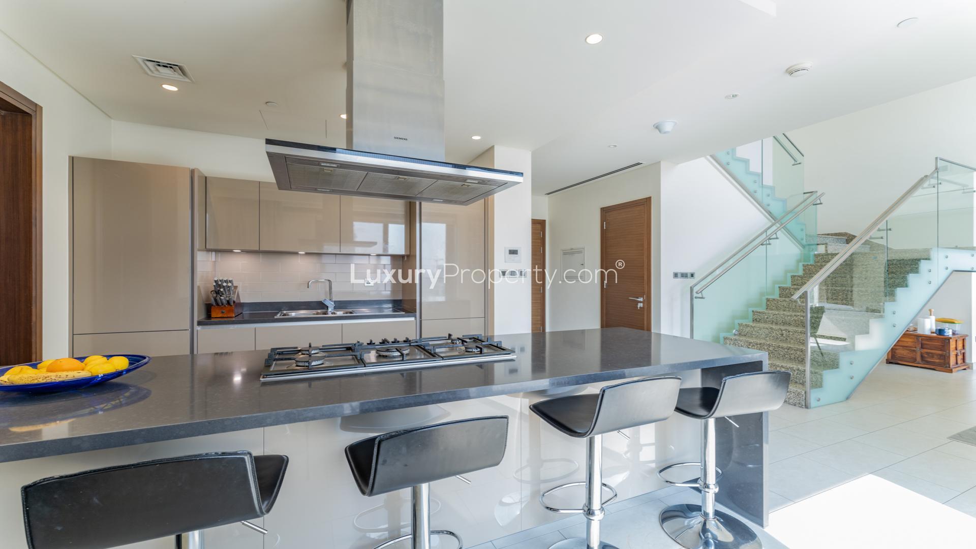 Bright living room in 3-bedroom duplex, Sobha Hartland, featuring modern decor and ample natural light