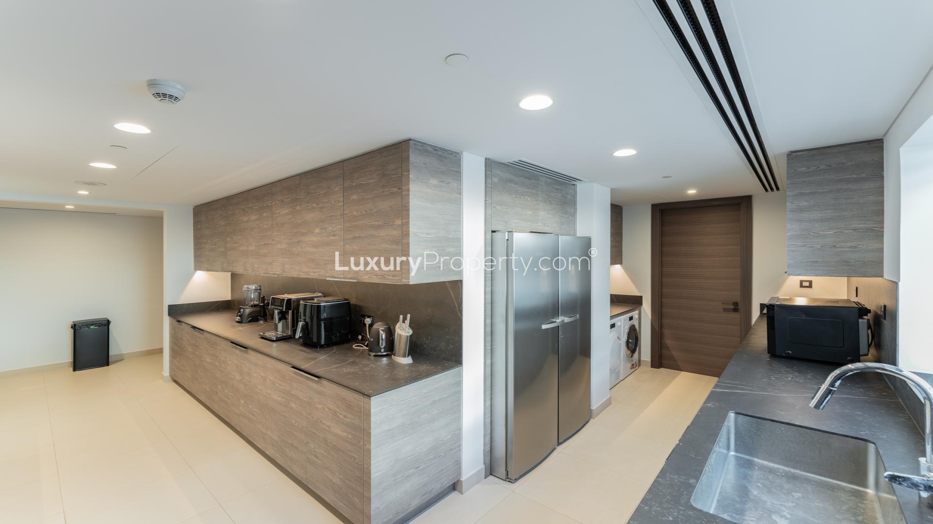 Balcony view from 3-bed apartment at W Residences, Palm Jumeirah, overlooking beach and skyline