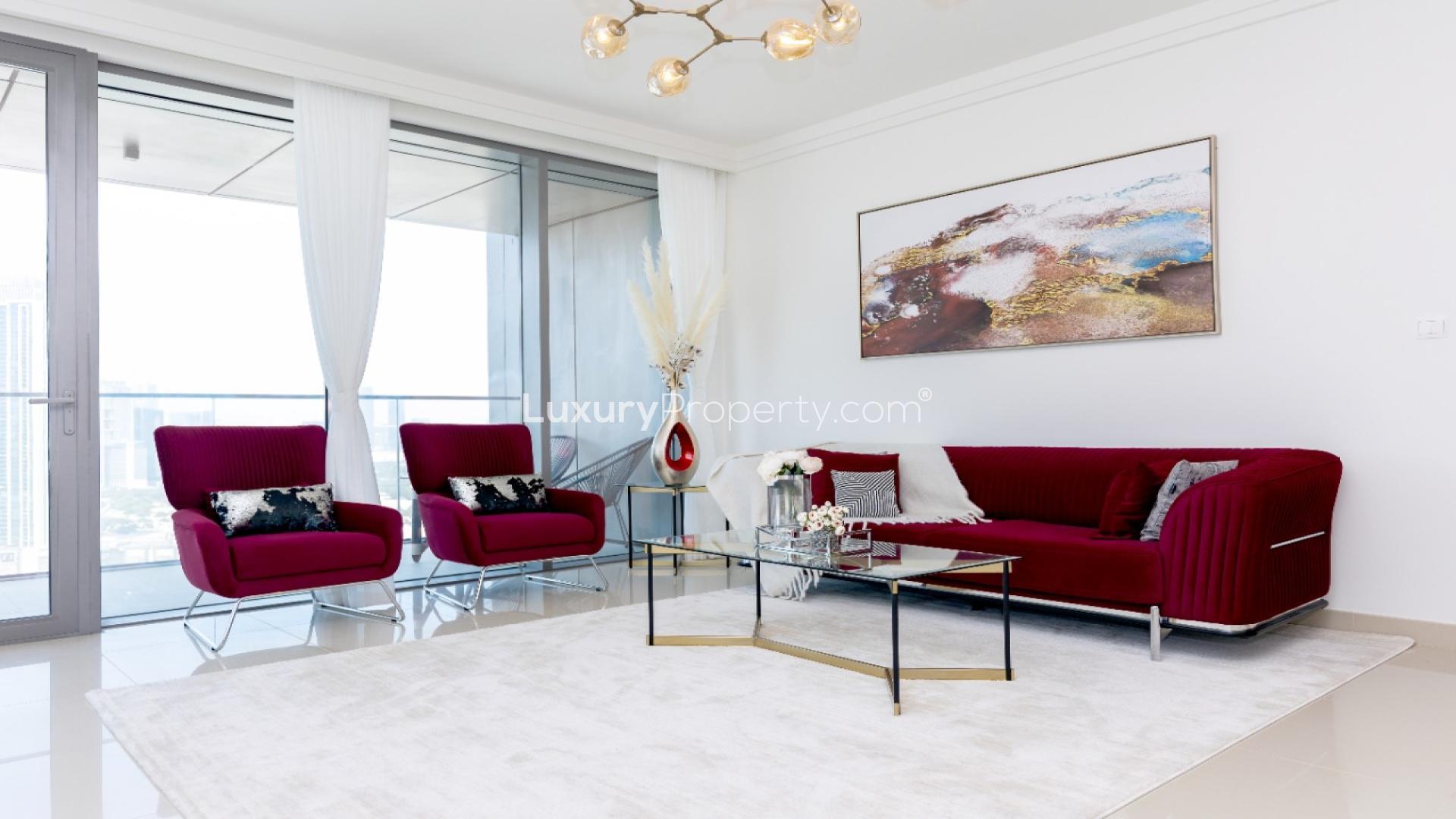 Balcony view from 3-bedroom apartment in Boulevard Point, Downtown Dubai, with green seating