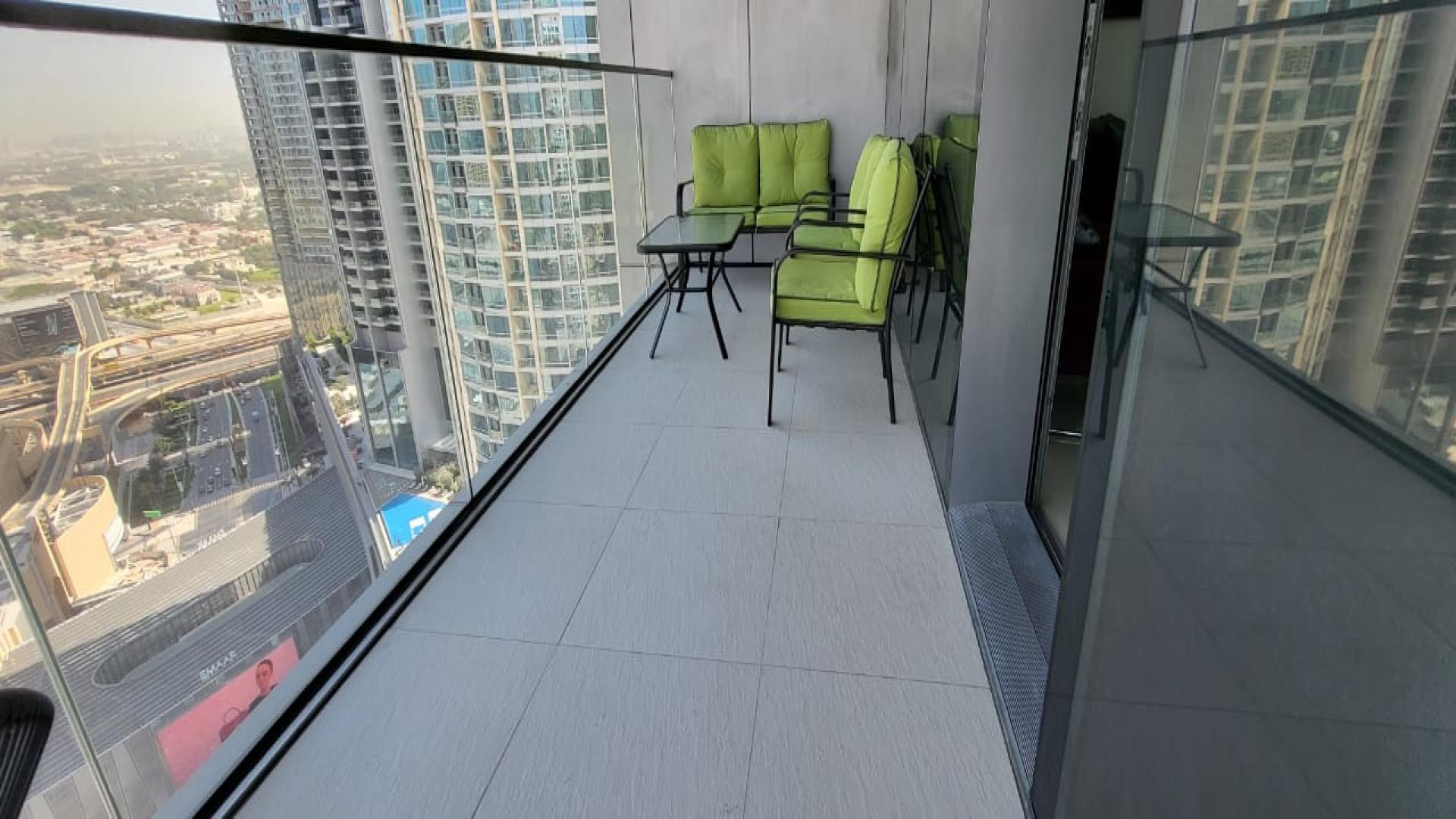 Spacious living room in 3-bedroom apartment, Boulevard Point, Downtown Dubai, elegant modern decor