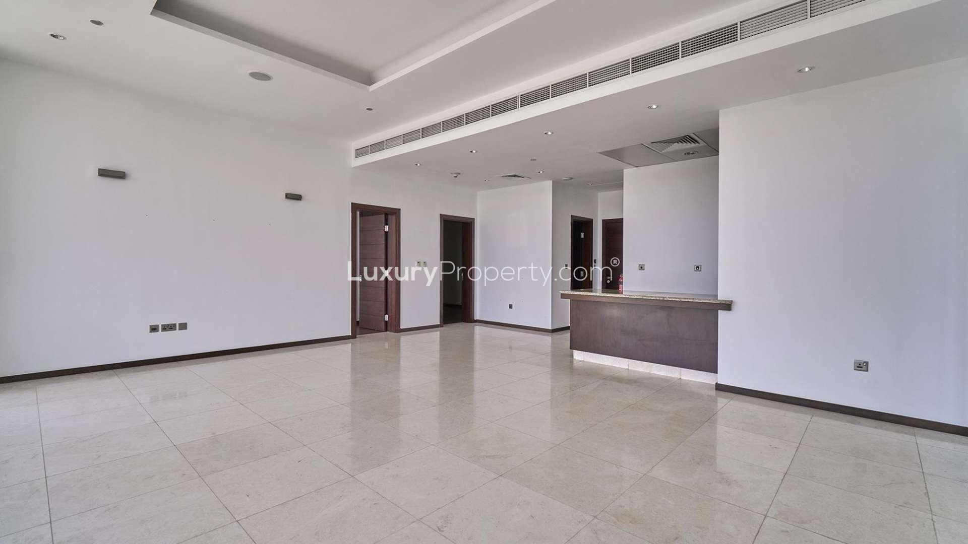 Spacious living area in 3-bedroom apartment, Tiara Residences, Palm Jumeirah, with large windows