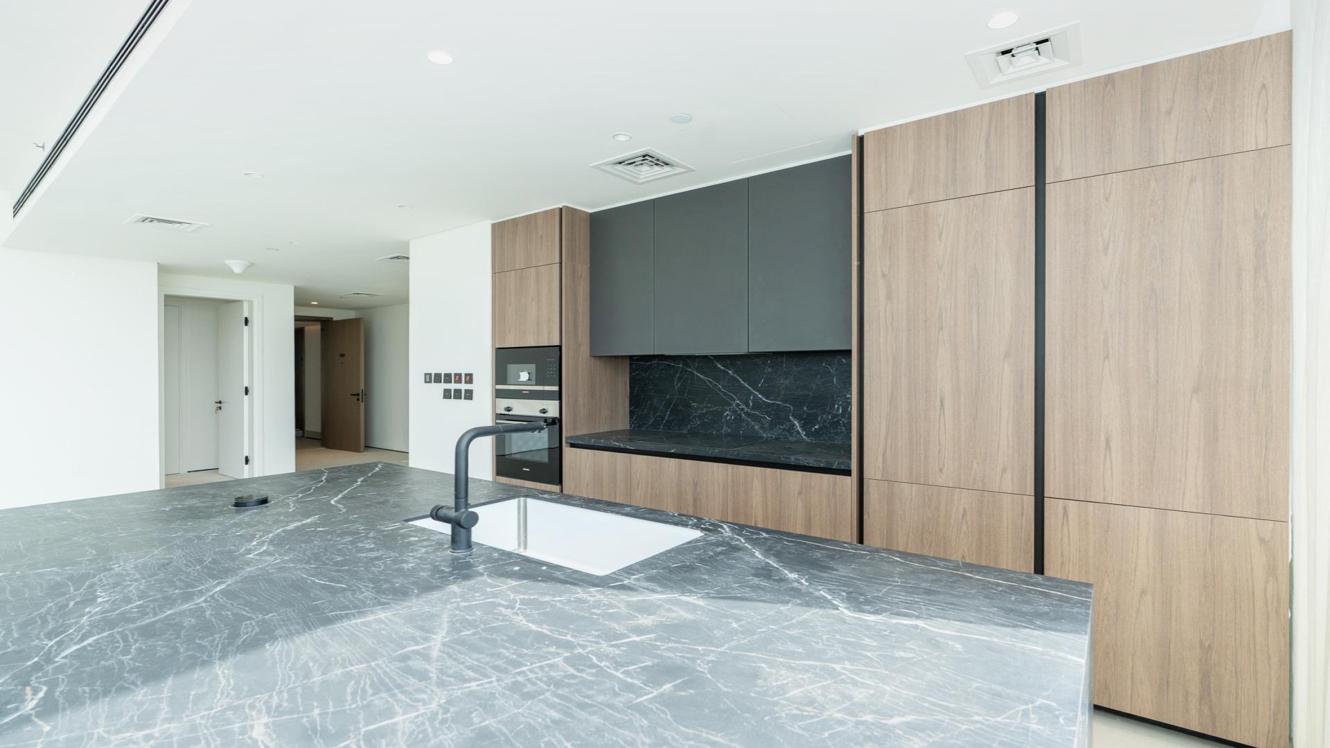 Modern kitchen in 3-bedroom apartment, Park Lane, Dubai Hills Estate, with large windows and island