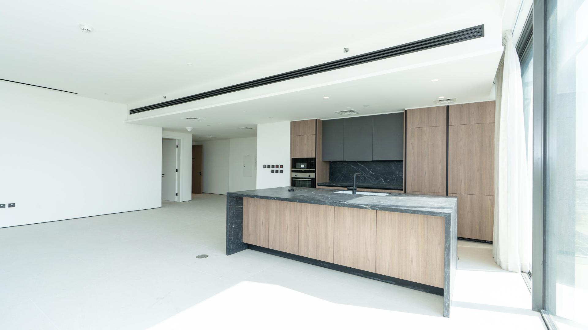 Modern kitchen in 3-bedroom apartment, Park Lane, Dubai Hills Estate, with sleek countertops and cabinetry